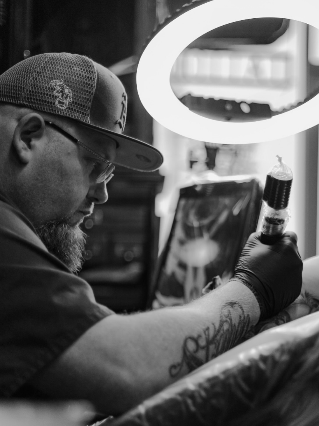 Script lettering lettering script tattoo on the upper arm by Big Steve Lewis