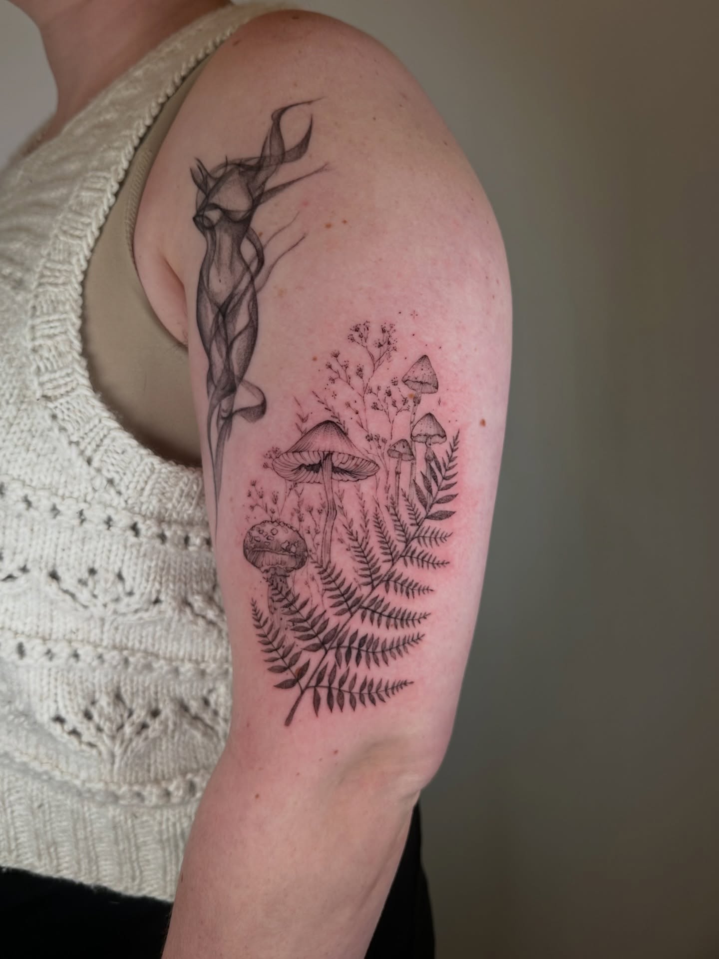 Mushroom and fern realism tattoo on the forearm by Seattle Fine Line Tattoo