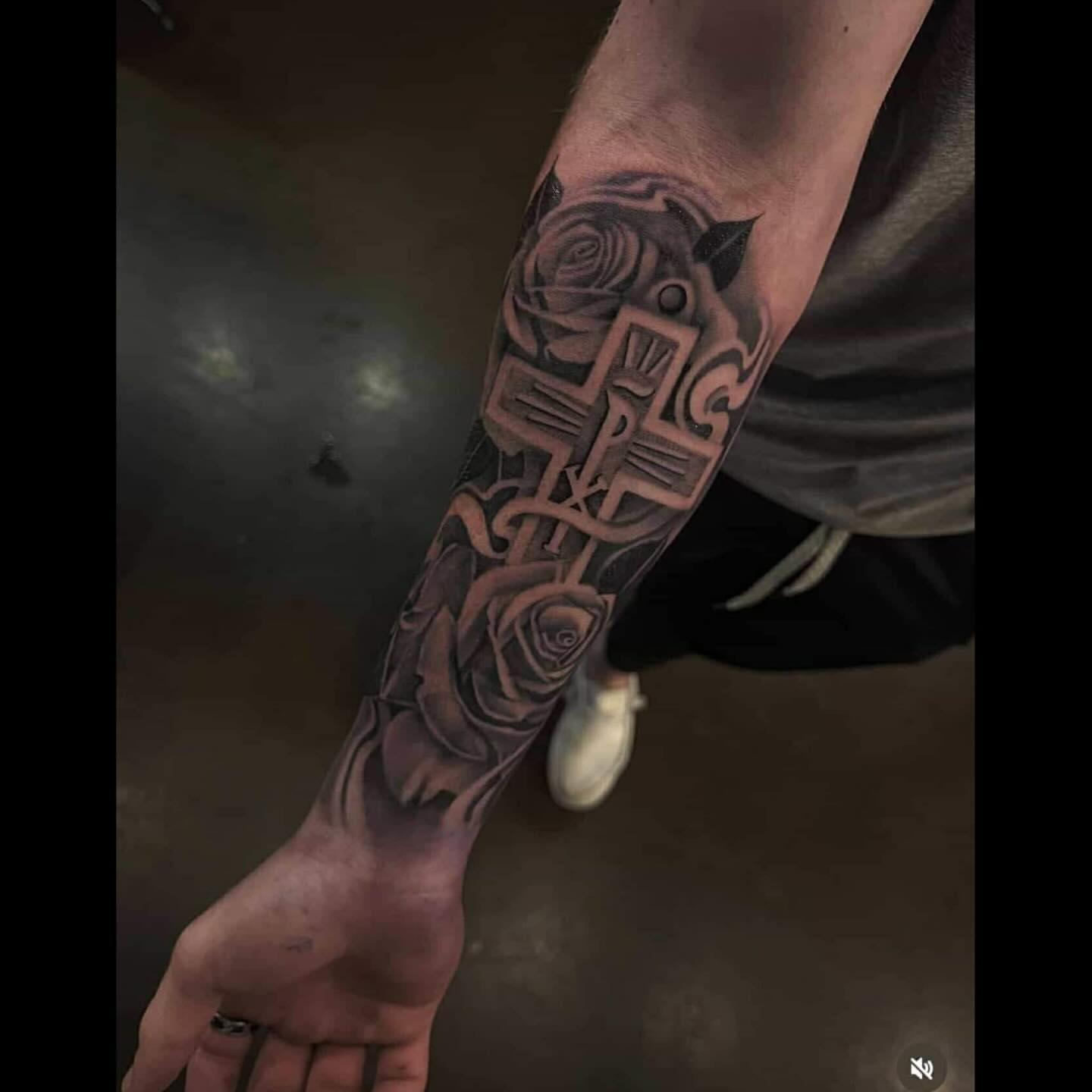 Cross and roses realism tattoo on the forearm by Smuk One