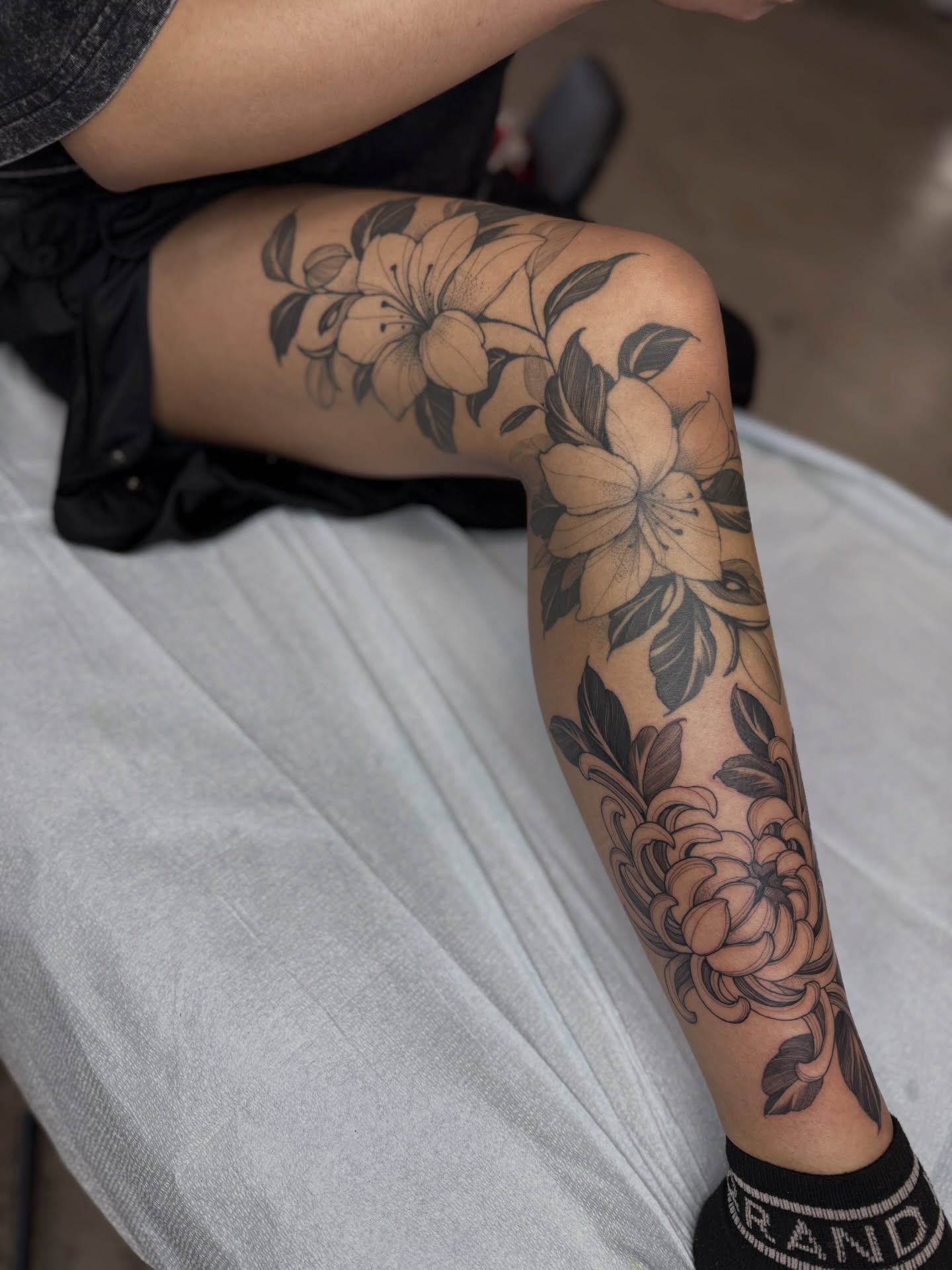 Floral arrangement black and grey tattoo on the forearm by 🥀michael Ta 🥀