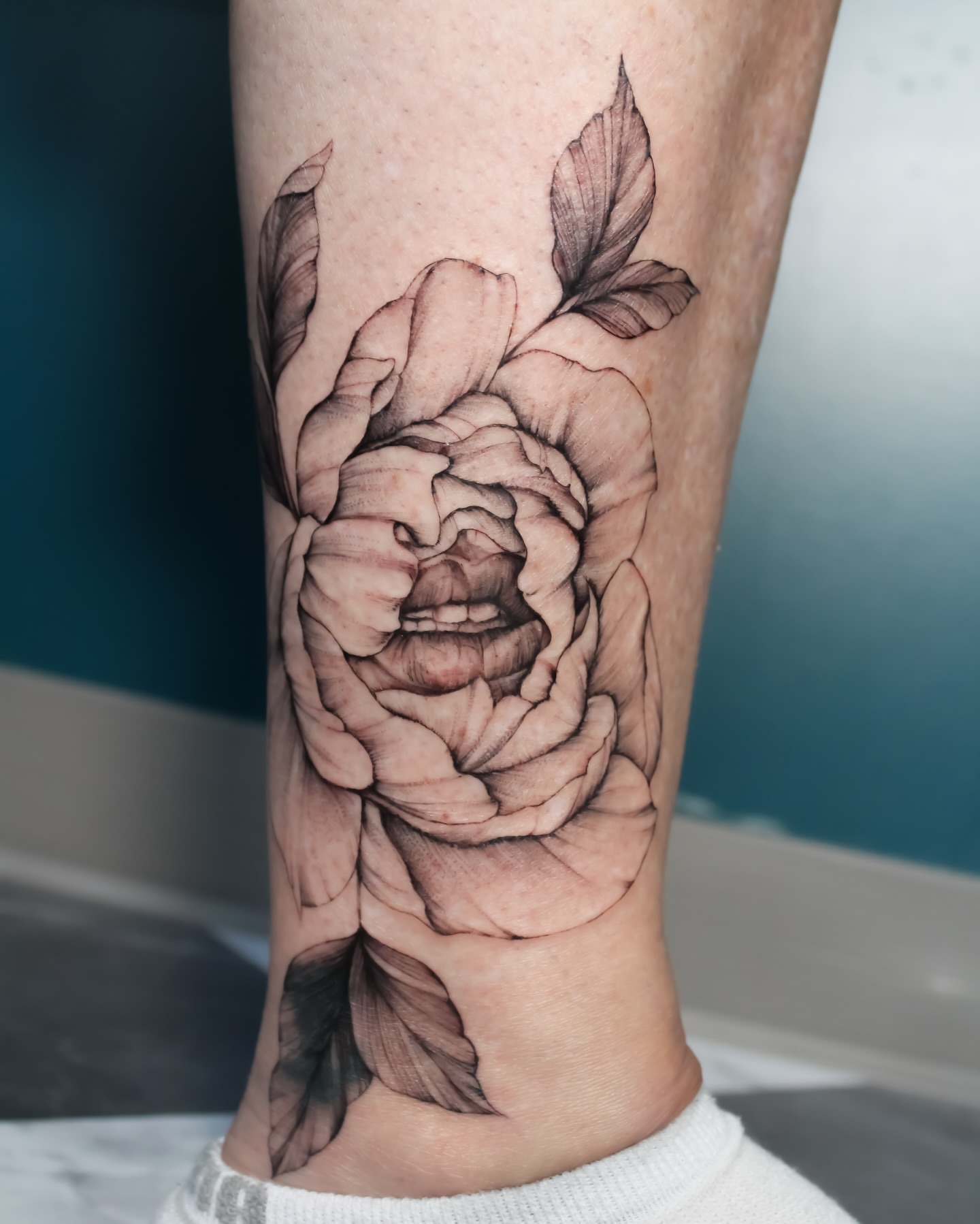 Rose realism tattoo on the calf by Amelia