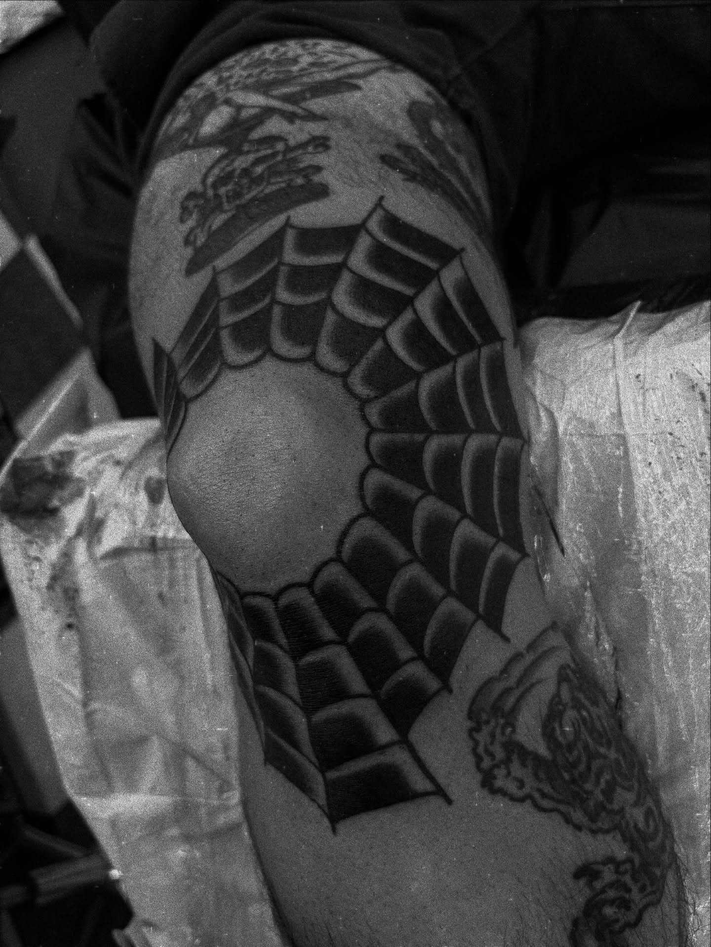 Wing black and grey tattoo on the thigh by Carlos Gonzalez Tattoo, Dallas, Texas
