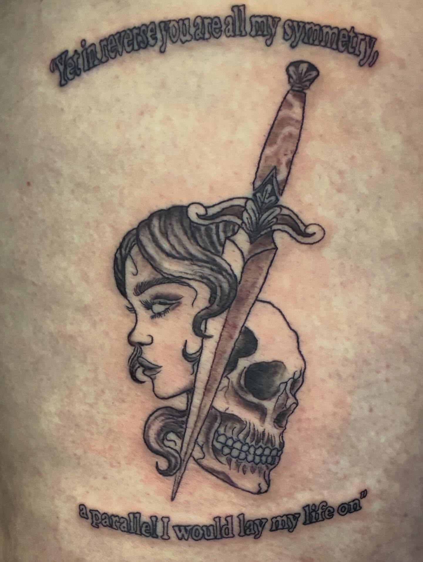 Woman's profile with dagger and skull realism tattoo on the thigh by Trae