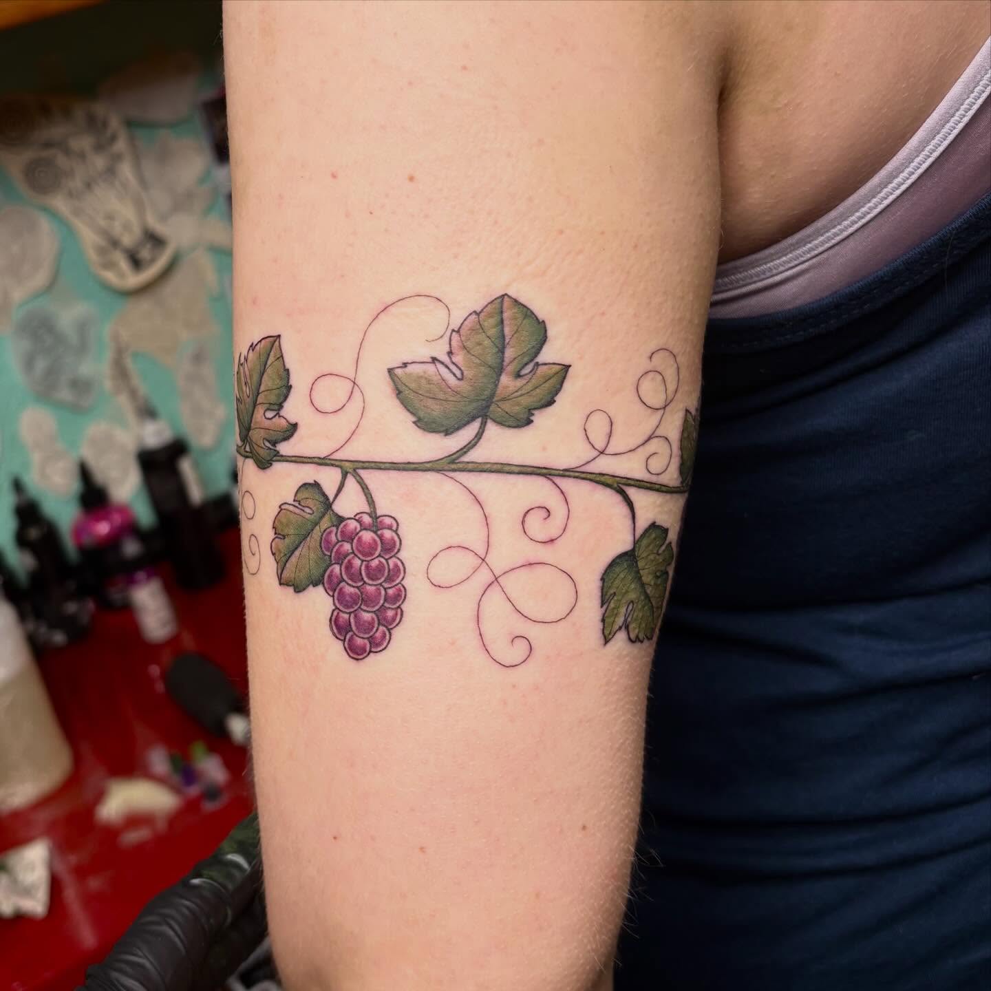 Grapes and leaves realism tattoo on the forearm by ♛Mollie Evans