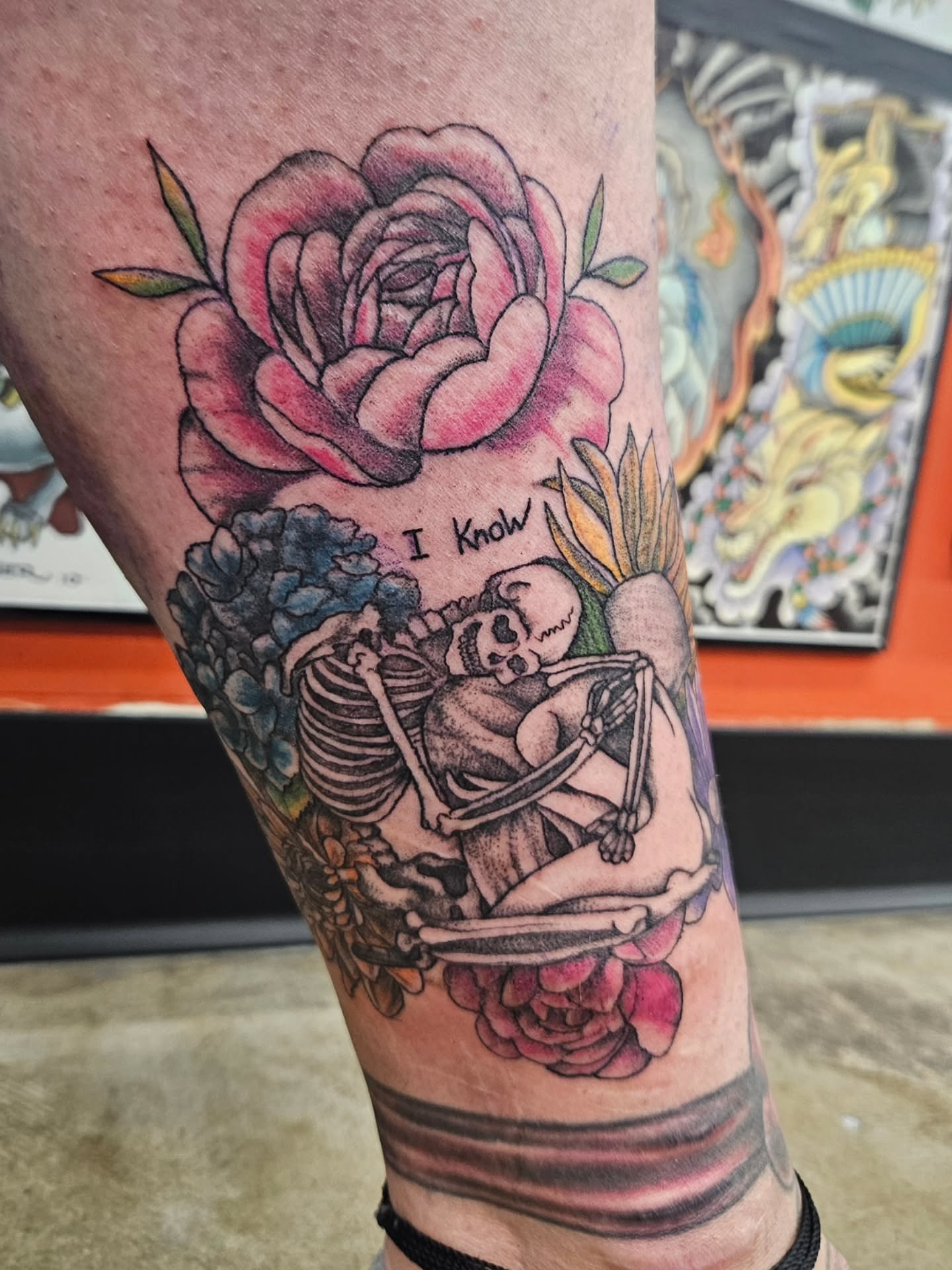 Skeleton and rose American traditional tattoo on the forearm by MK Stevens - Greeley Based Tattoo Artist