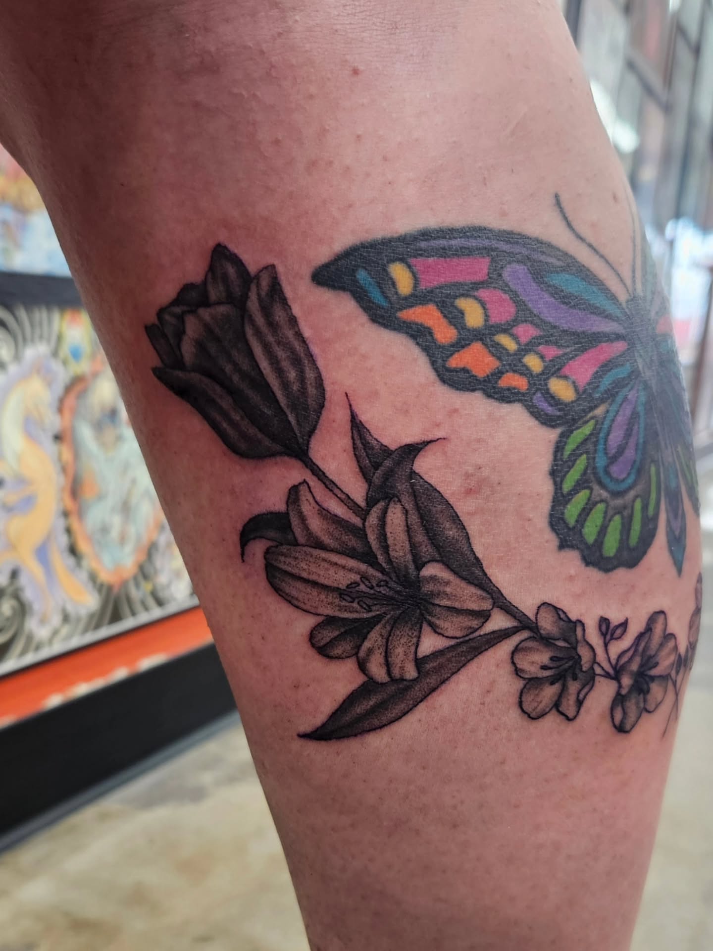Butterfly and flowers new school tattoo on the forearm by MK Stevens - Greeley Based Tattoo Artist
