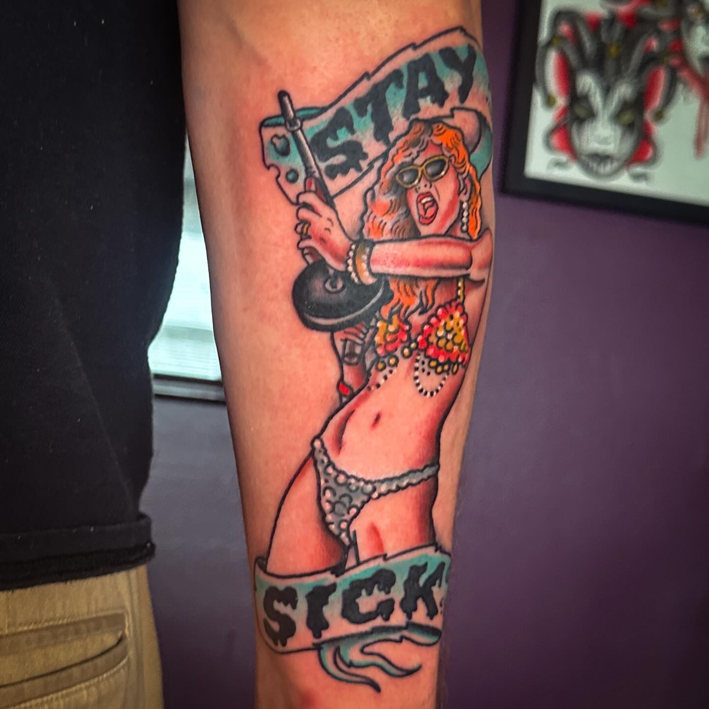 Woman with frying pan American traditional tattoo on the forearm by Stacey Colangelo