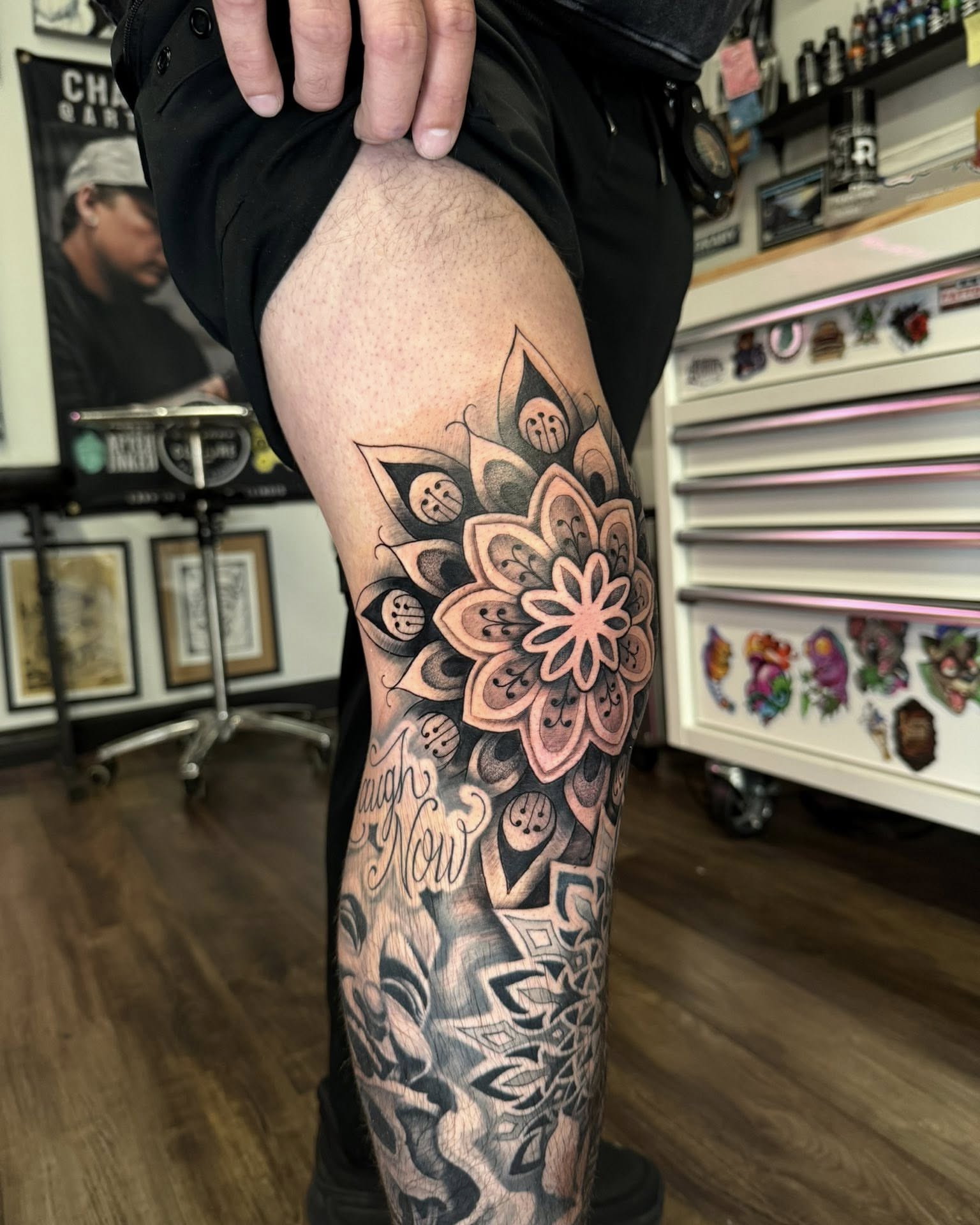 Floral mandala geometric tattoo on the thigh by Chad Meado