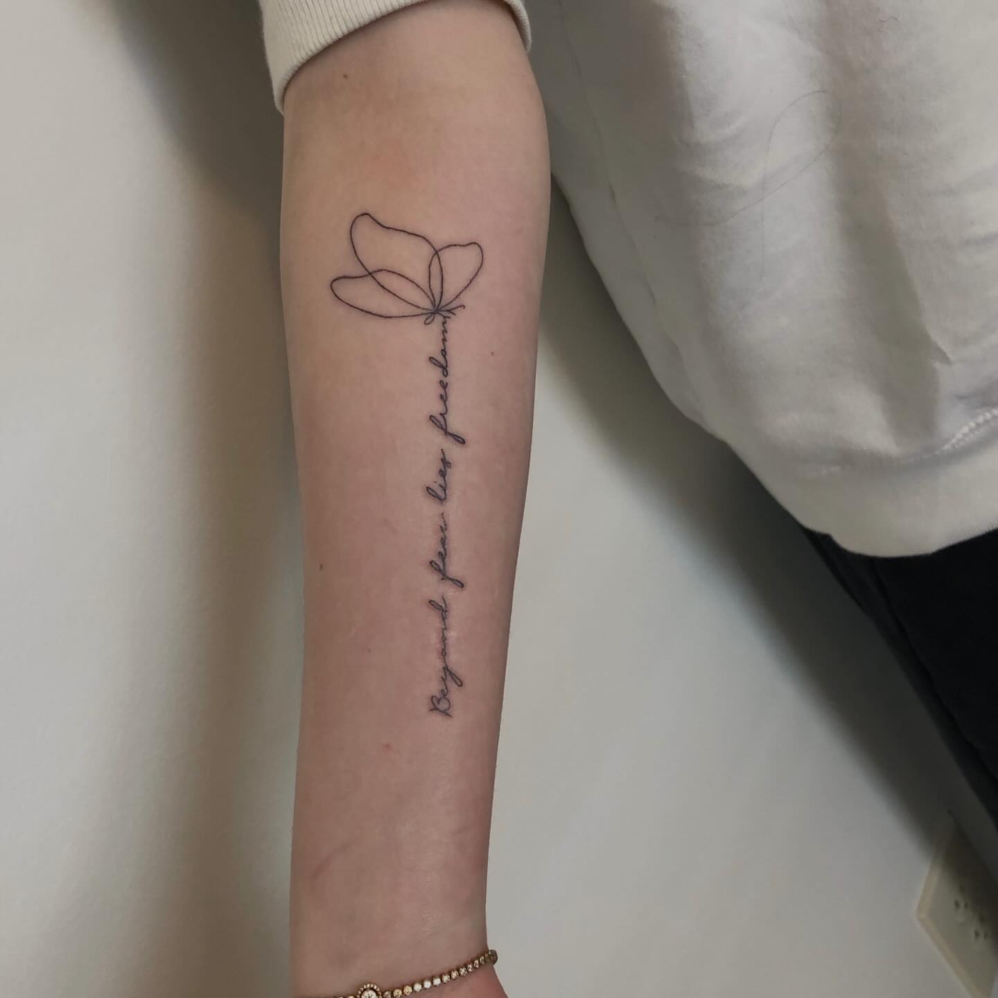 Dragonfly fine line tattoo on the forearm by Lexie Decker, Canton, Ohio