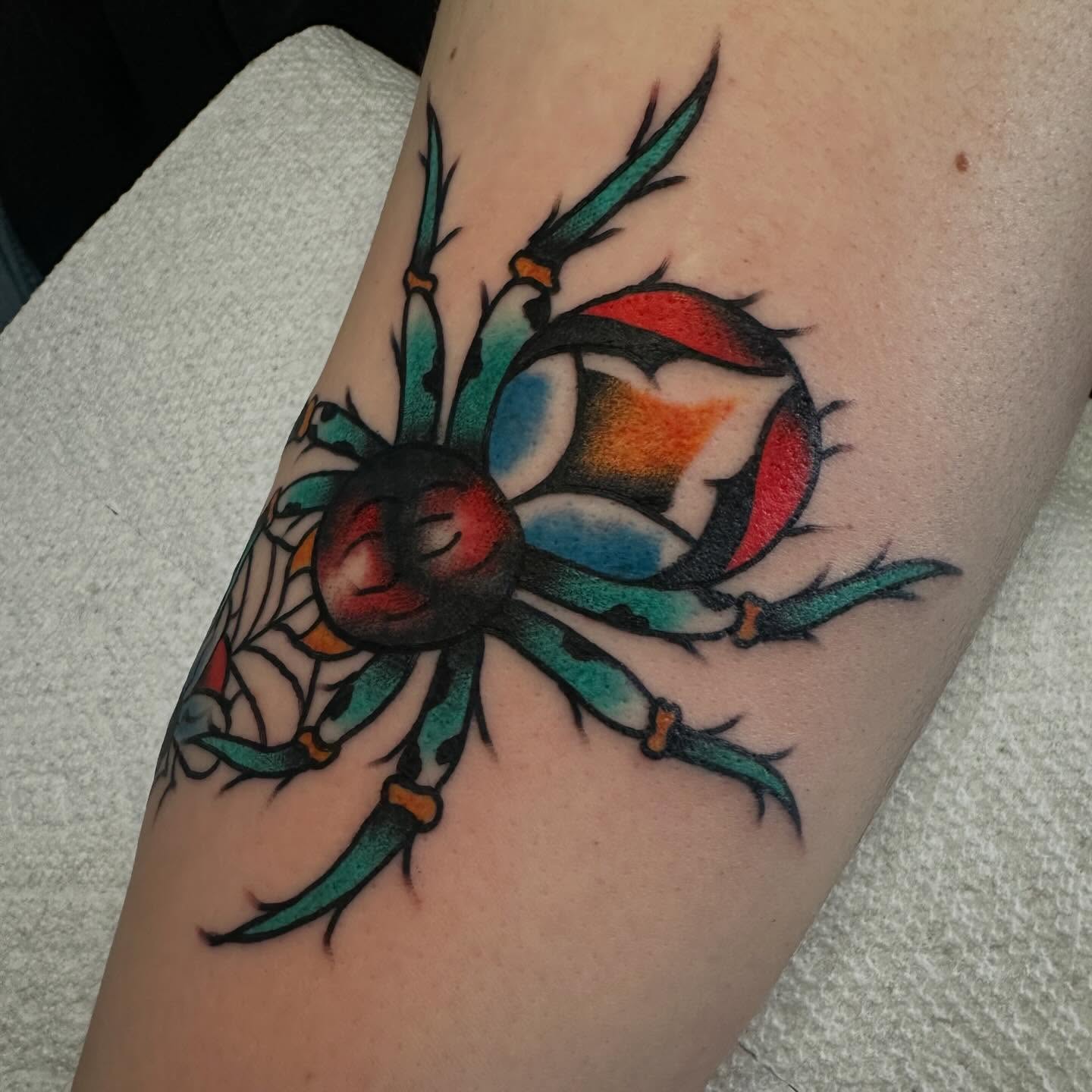 Spider American traditional tattoo on the forearm by Elisha B🦷