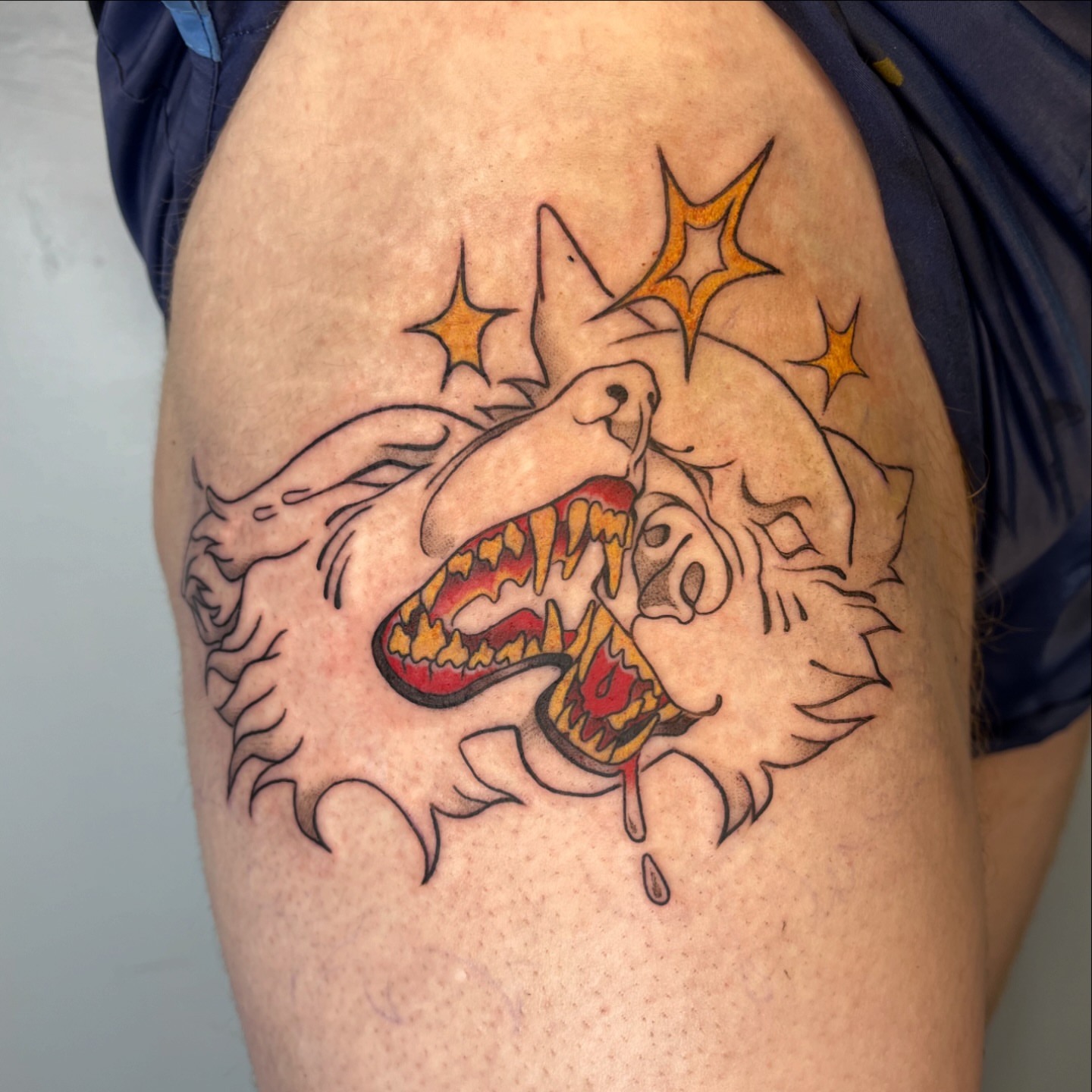 Wolf American traditional tattoo on the thigh by Iggy Montgomery (they