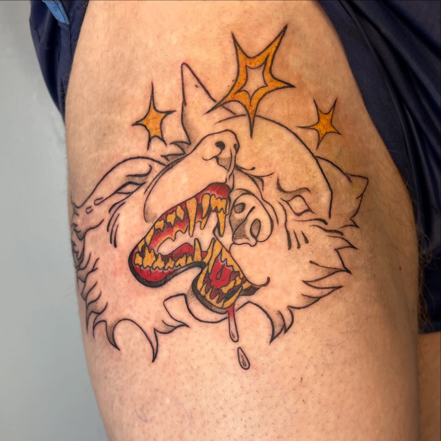 Wolf American traditional tattoo on the thigh by Iggy Montgomery (they