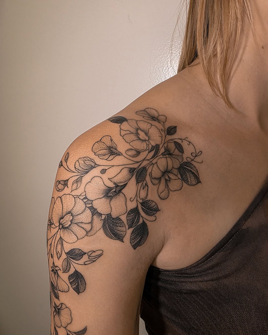 Floral arrangement dotwork tattoo on the shoulder by Richmond tattoo shop, Richmond, Texas