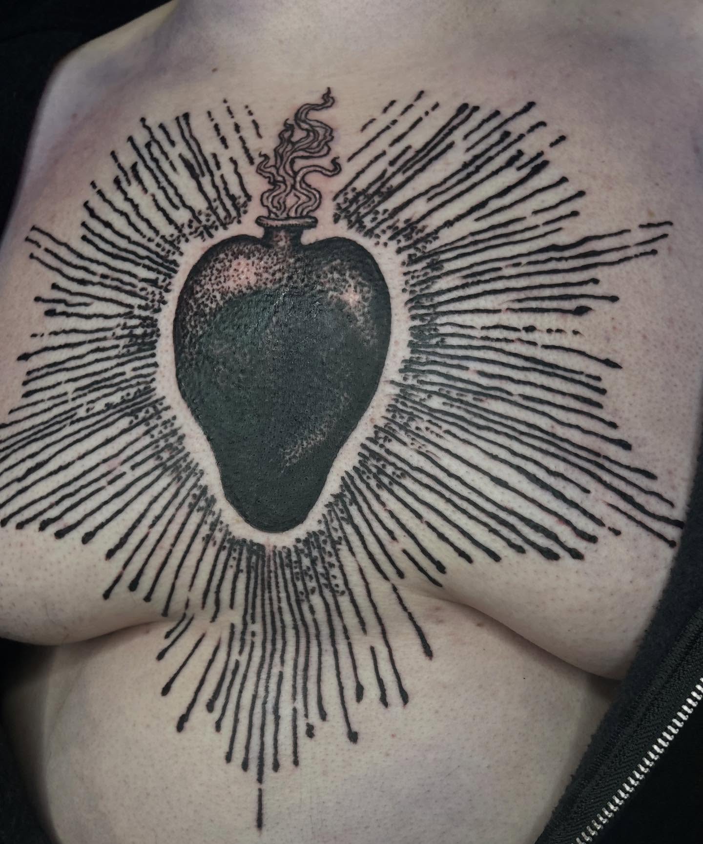 Heart with flame dotwork tattoo on the chest by ๐๐๐๐๐๐ ๐๐๐๐๐๐ ๐๐๐๐๐๐