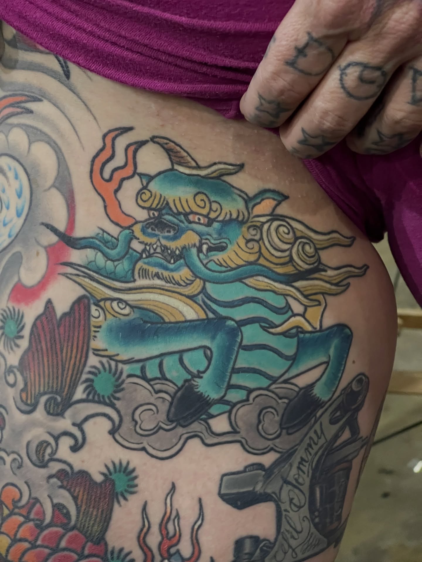 Serpent and clouds American traditional tattoo on the thigh by Dale Callahan, Olympia, Washington