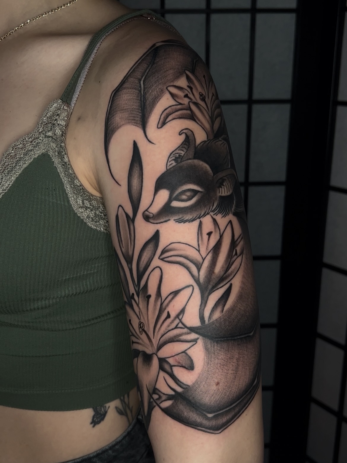 Fox and lilies realism tattoo on the forearm by Vic Merkley