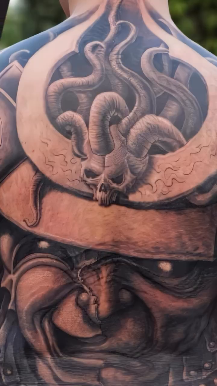 Monstrous creature dark realism tattoo by Paul Booth
