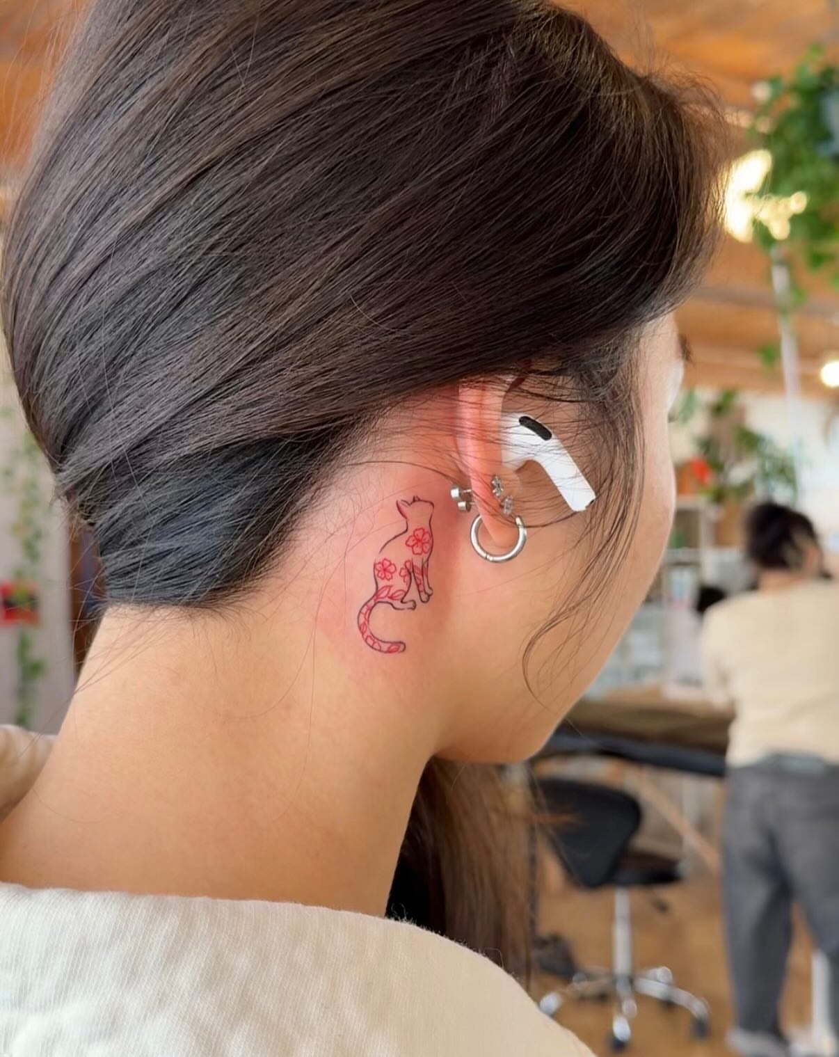 Cat dotwork tattoo on the neck by Ethan