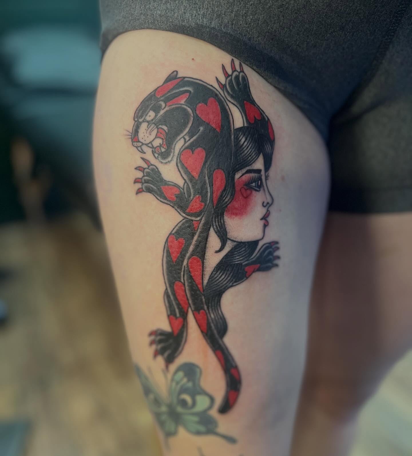 Panther and woman American traditional tattoo on the thigh by Victorian Coleman