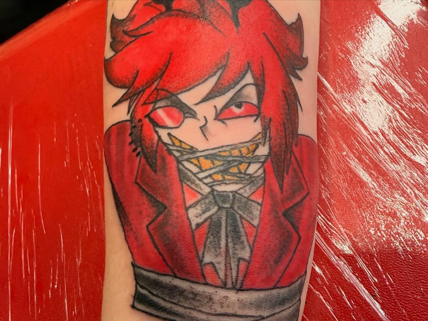 Red-haired character anime tattoo on the forearm by Jones Eric