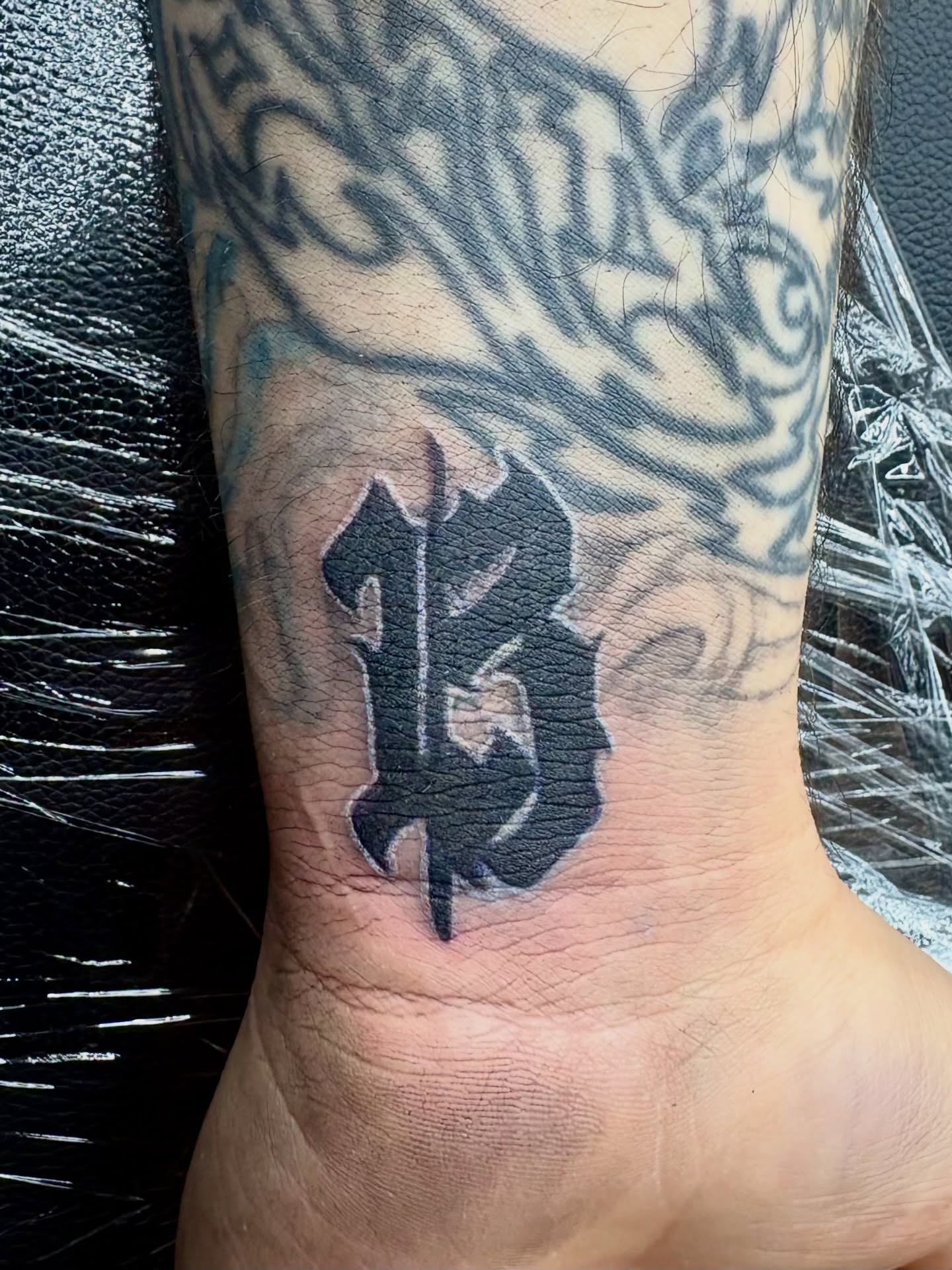 Number 13 black and grey tattoo on the foot by Deacon Moser