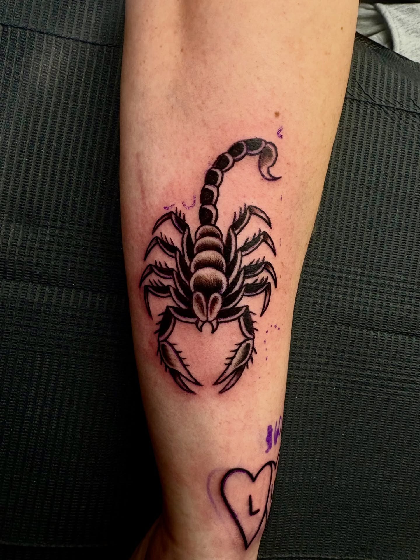 Scorpion black and grey tattoo on the forearm by Deacon Moser