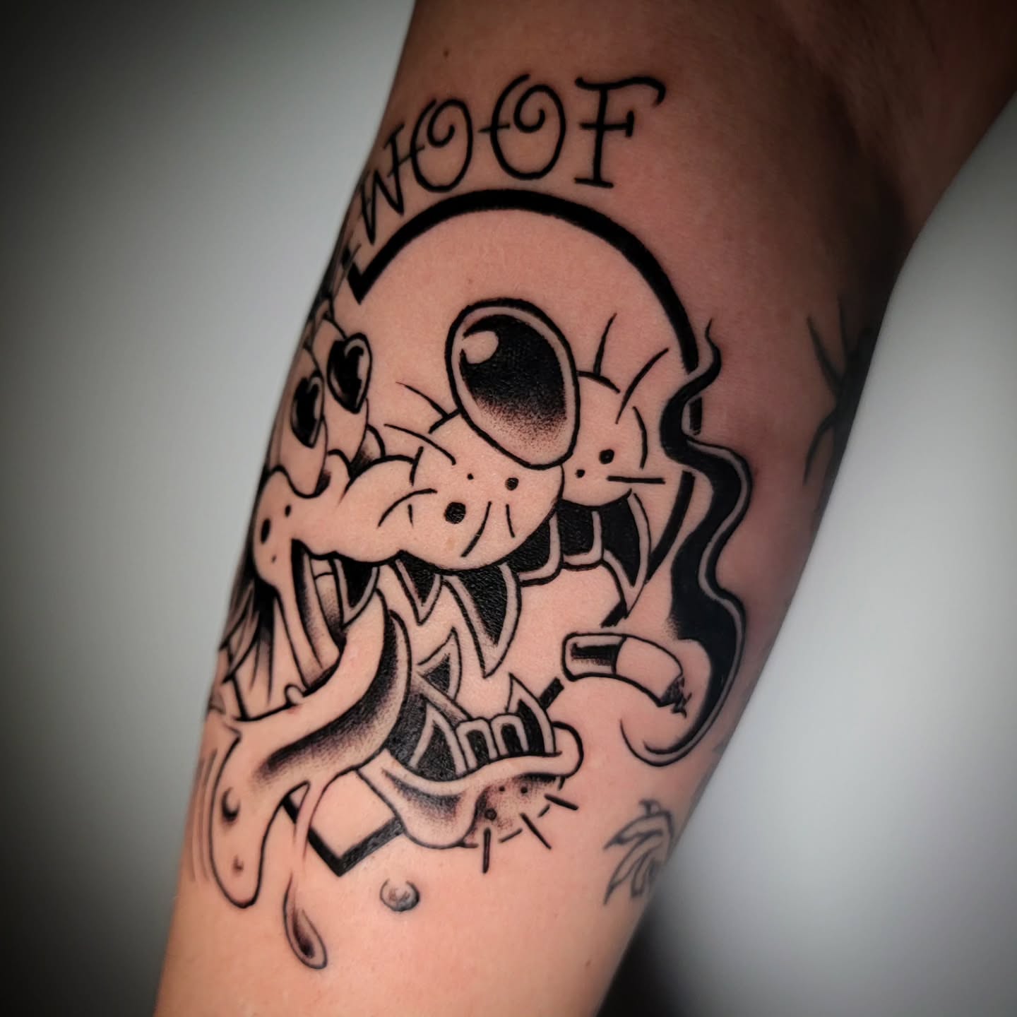 Dog American traditional tattoo on the forearm by Randyz Tattyz