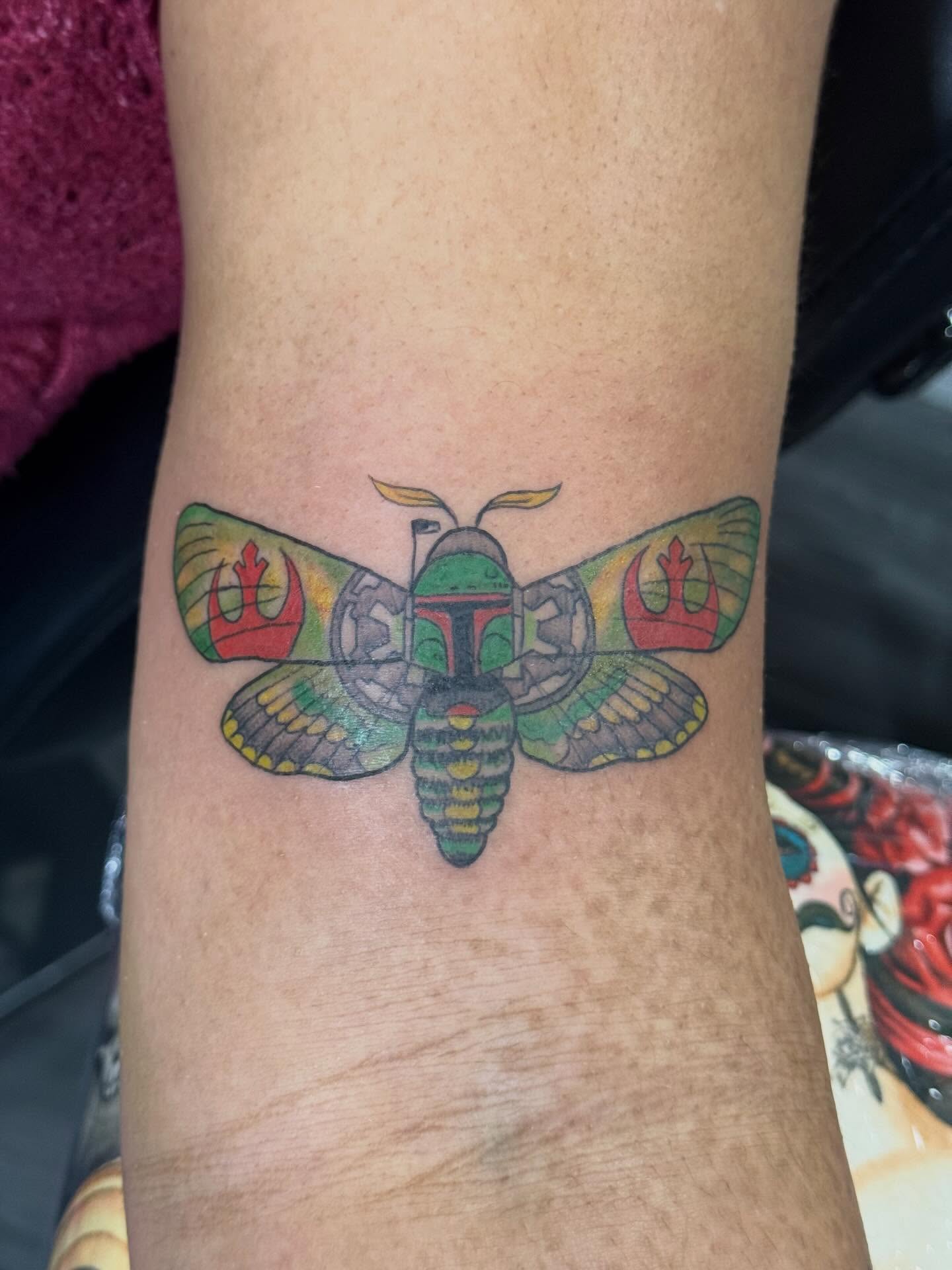 Moth geometric tattoo on the forearm by Camryn Justice