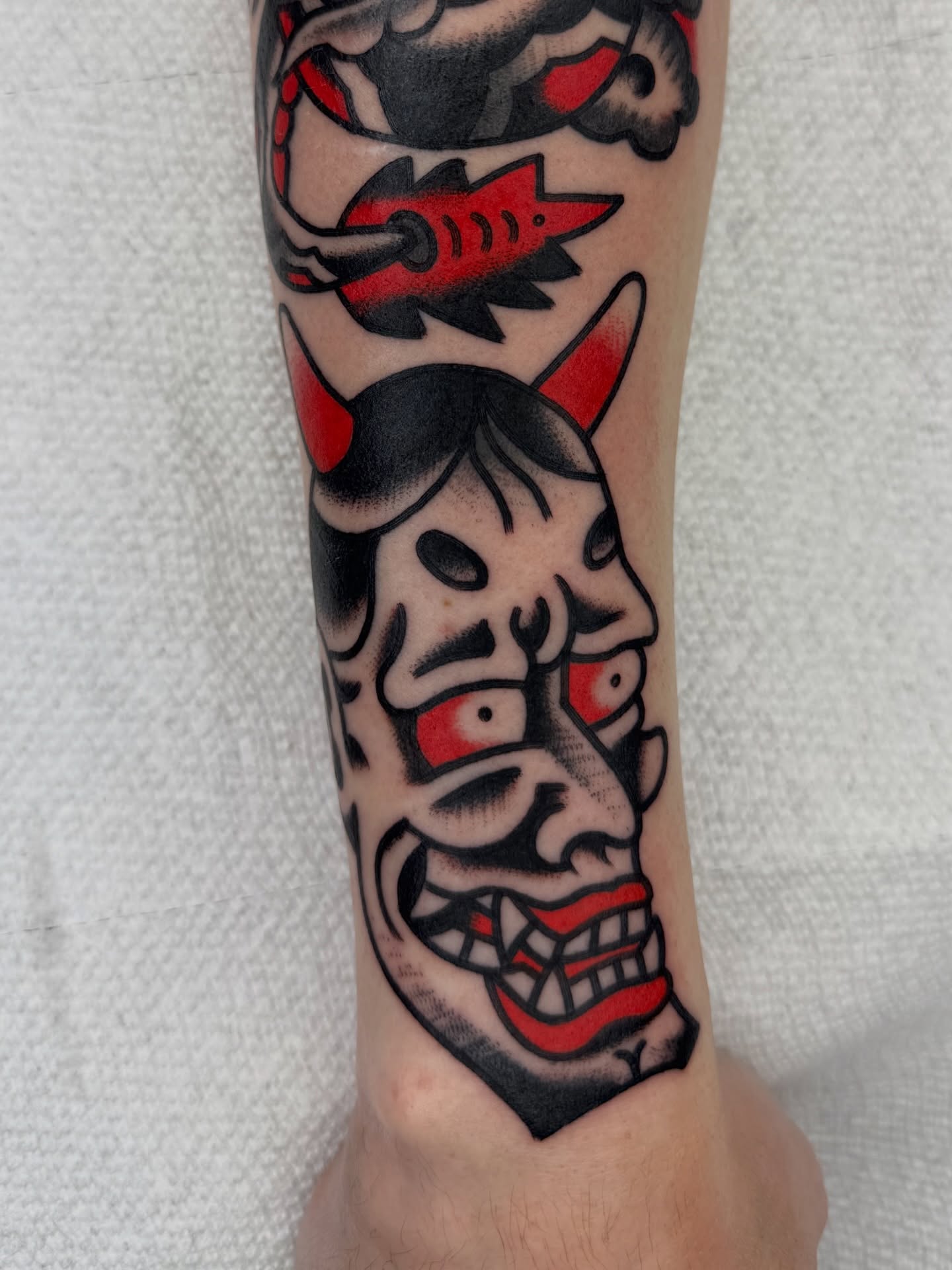 Demon mask American traditional tattoo on the forearm by لا Kenny McCabe لا
