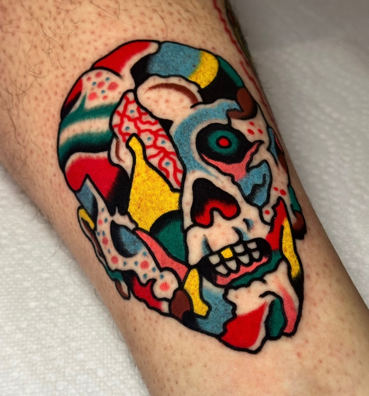 Skull American traditional tattoo on the forearm by Christian Rieben