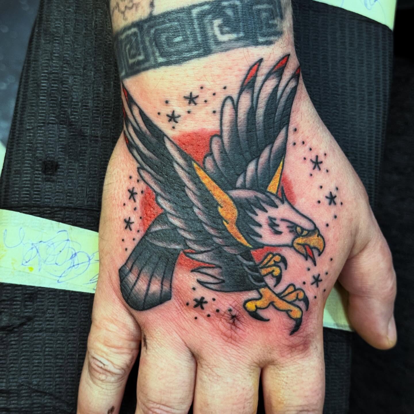 Eagle American traditional tattoo on the hand by Jack Hatchet Tattoos
