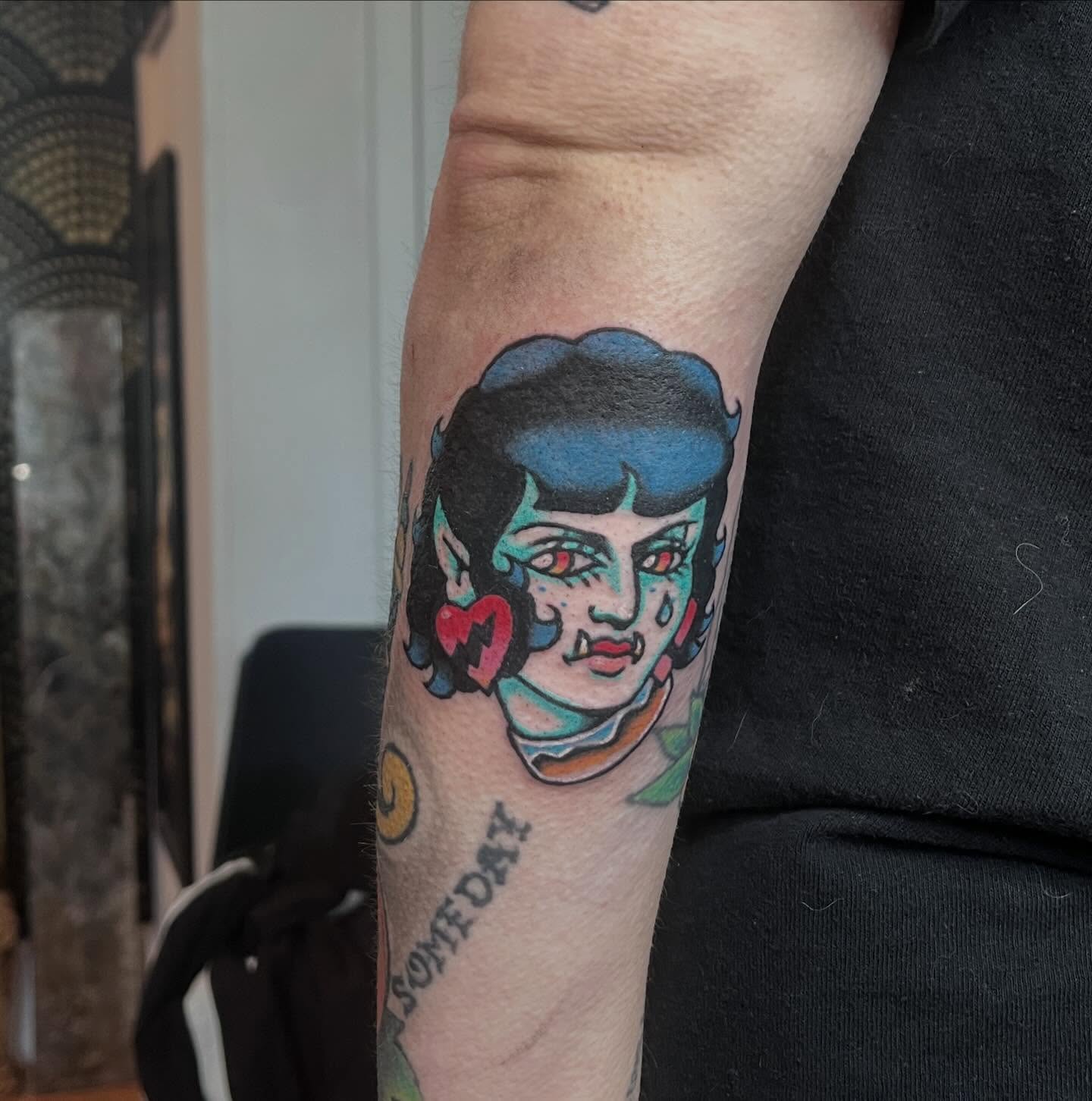 Woman with heart American traditional tattoo on the forearm by madelynne (maddie) caldwell tattoos