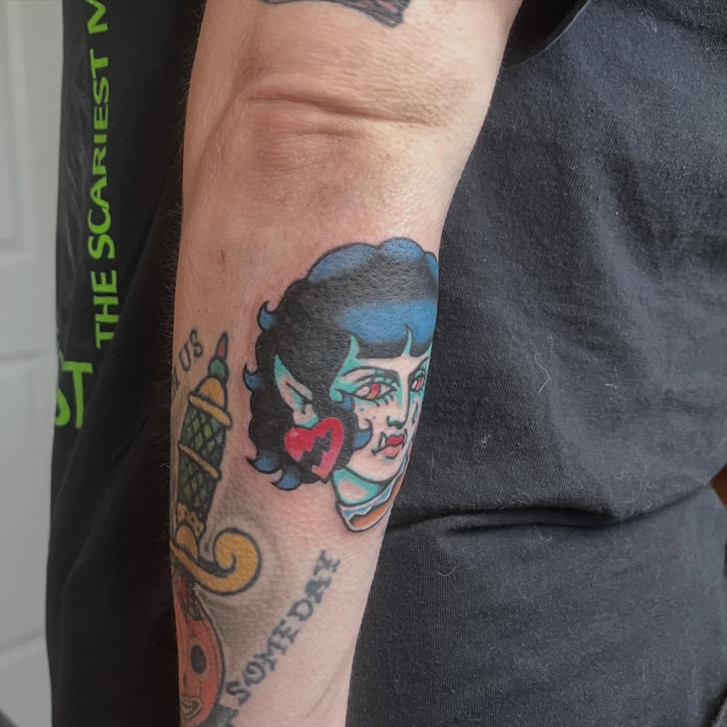 Woman with heart American traditional tattoo on the forearm by madelynne (maddie) caldwell tattoos
