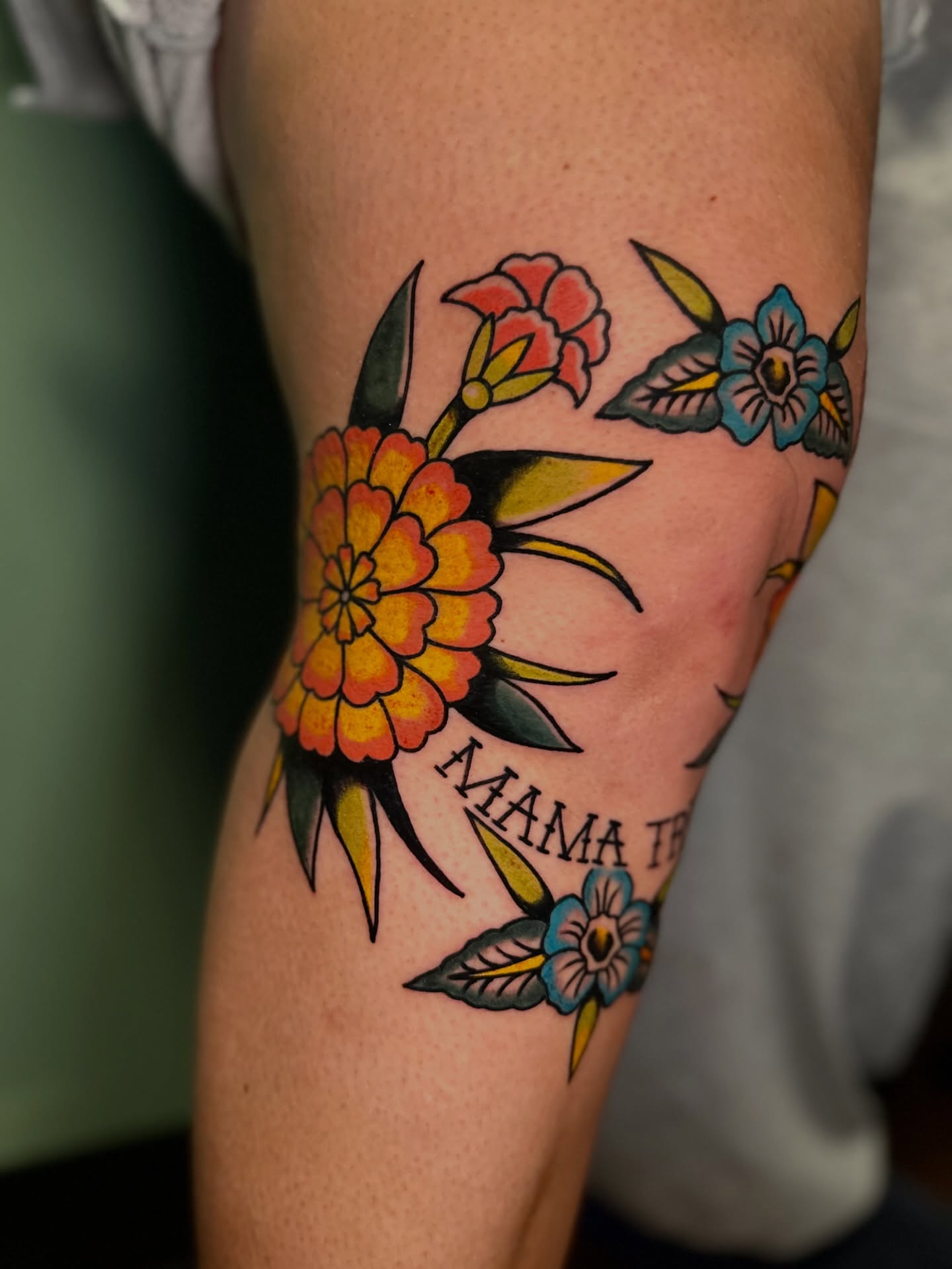 Floral arrangement American traditional tattoo on the forearm by Nick Weaver aka gibby sometimes gilbert