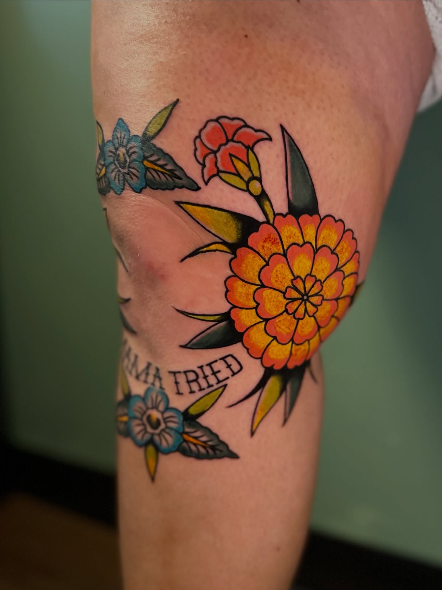 Floral arrangement American traditional tattoo on the forearm by Nick Weaver aka gibby sometimes gilbert
