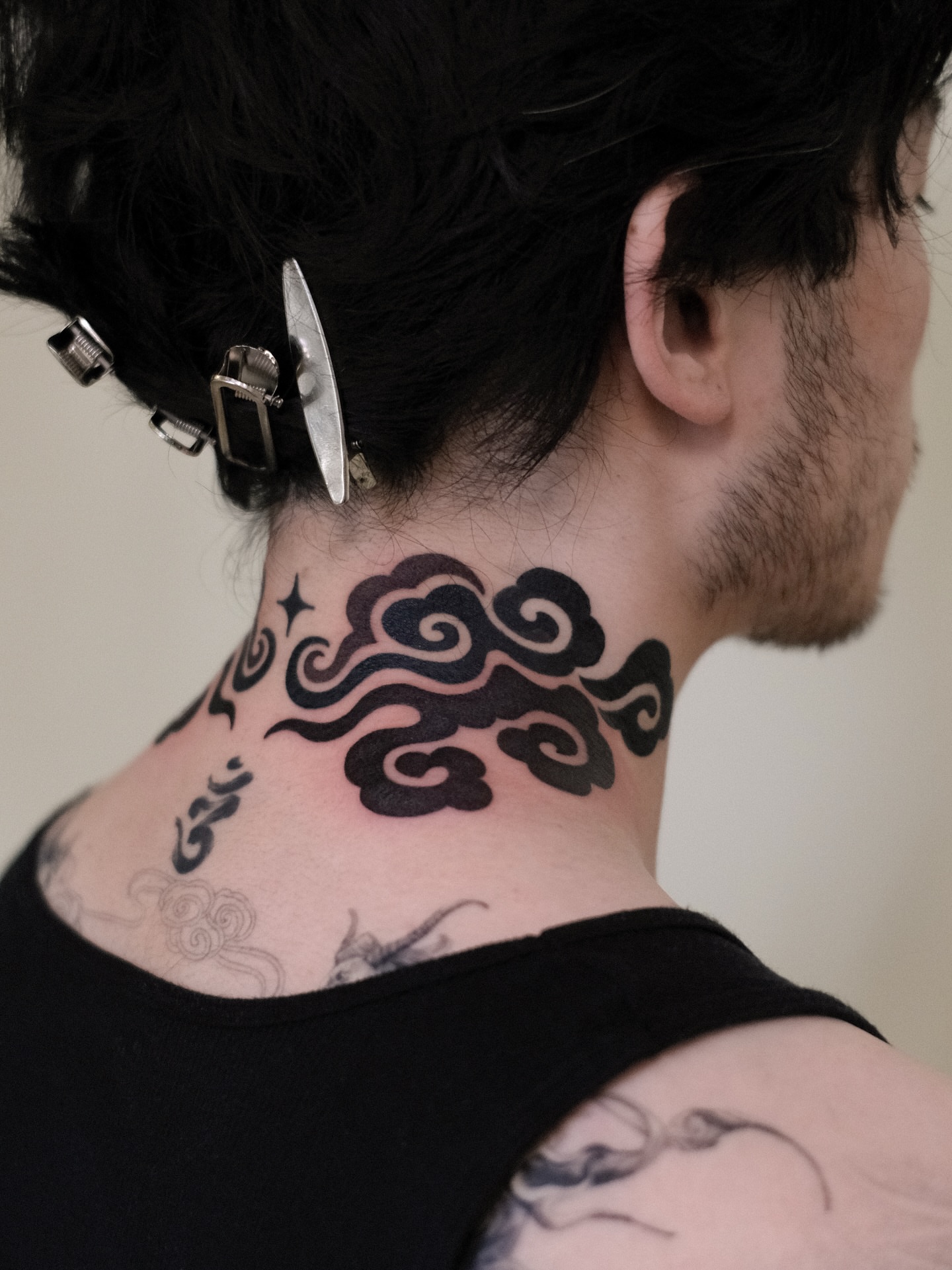 Clouds black and grey tattoo on the neck by seattle tattoo artist
