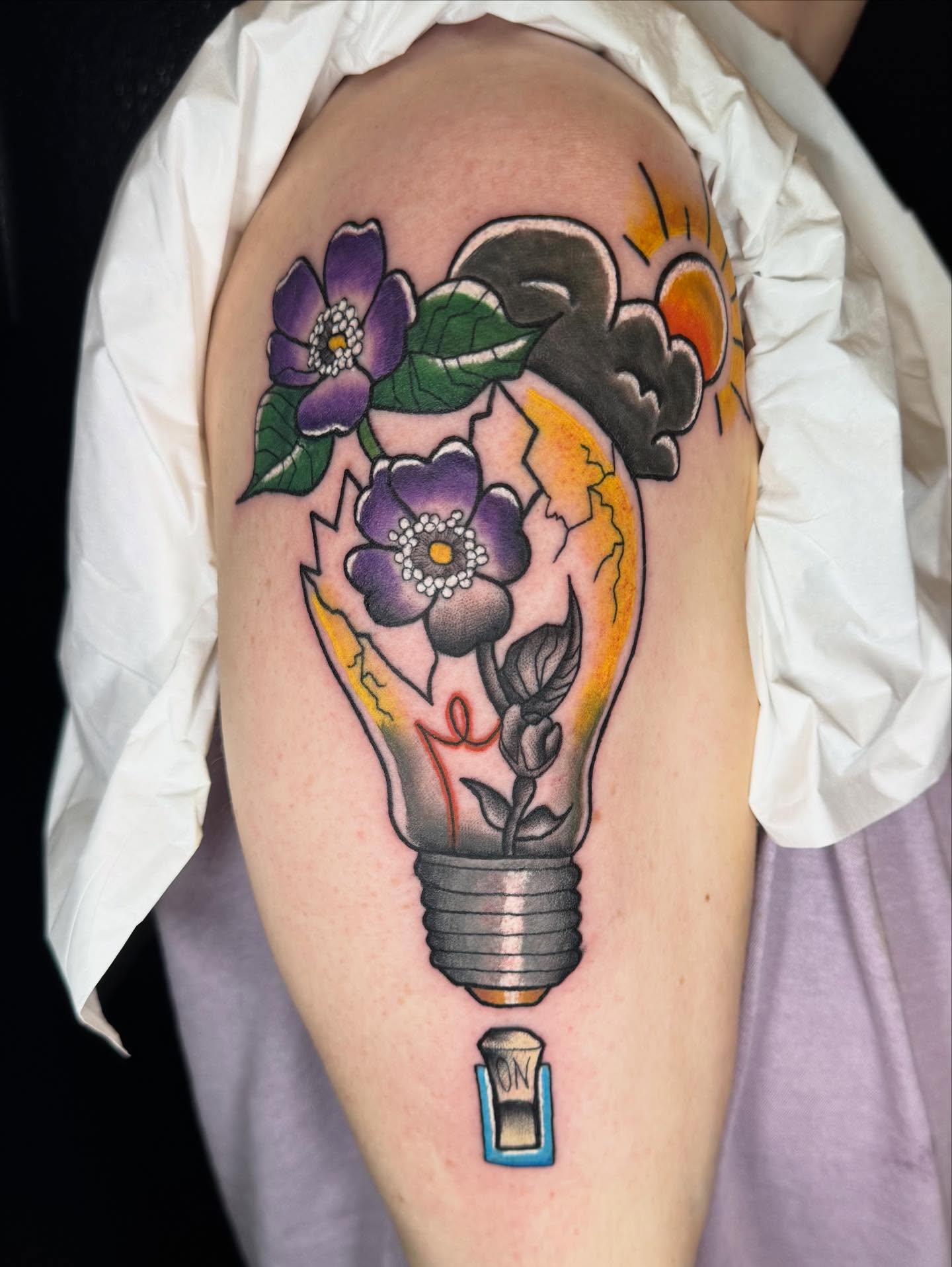 Light bulb with flowers American traditional tattoo on the thigh by Zakariah⚡️🏳️‍⚧️✨