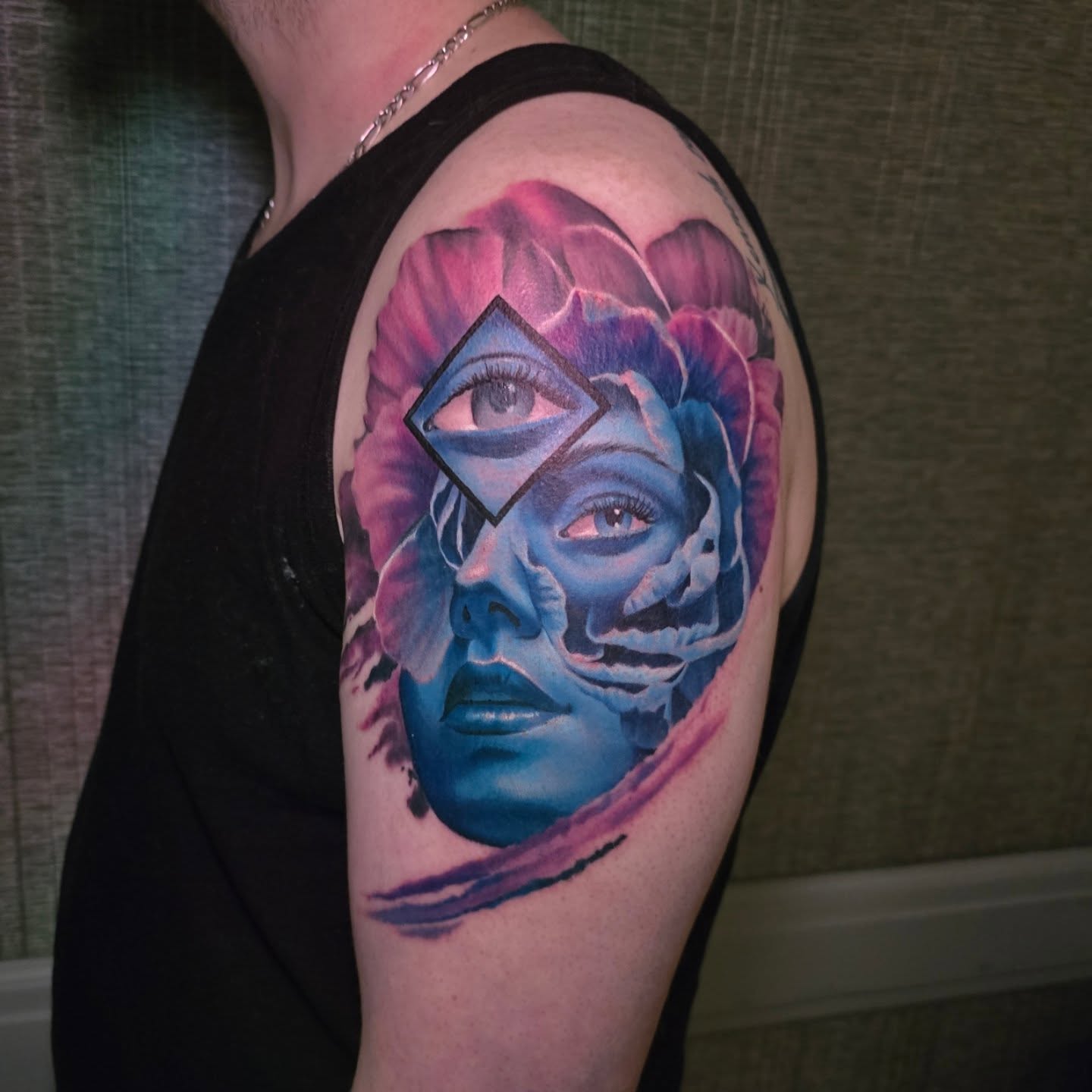 Abstract face geometric tattoo on the shoulder by Gabrielle Nicole Soucie