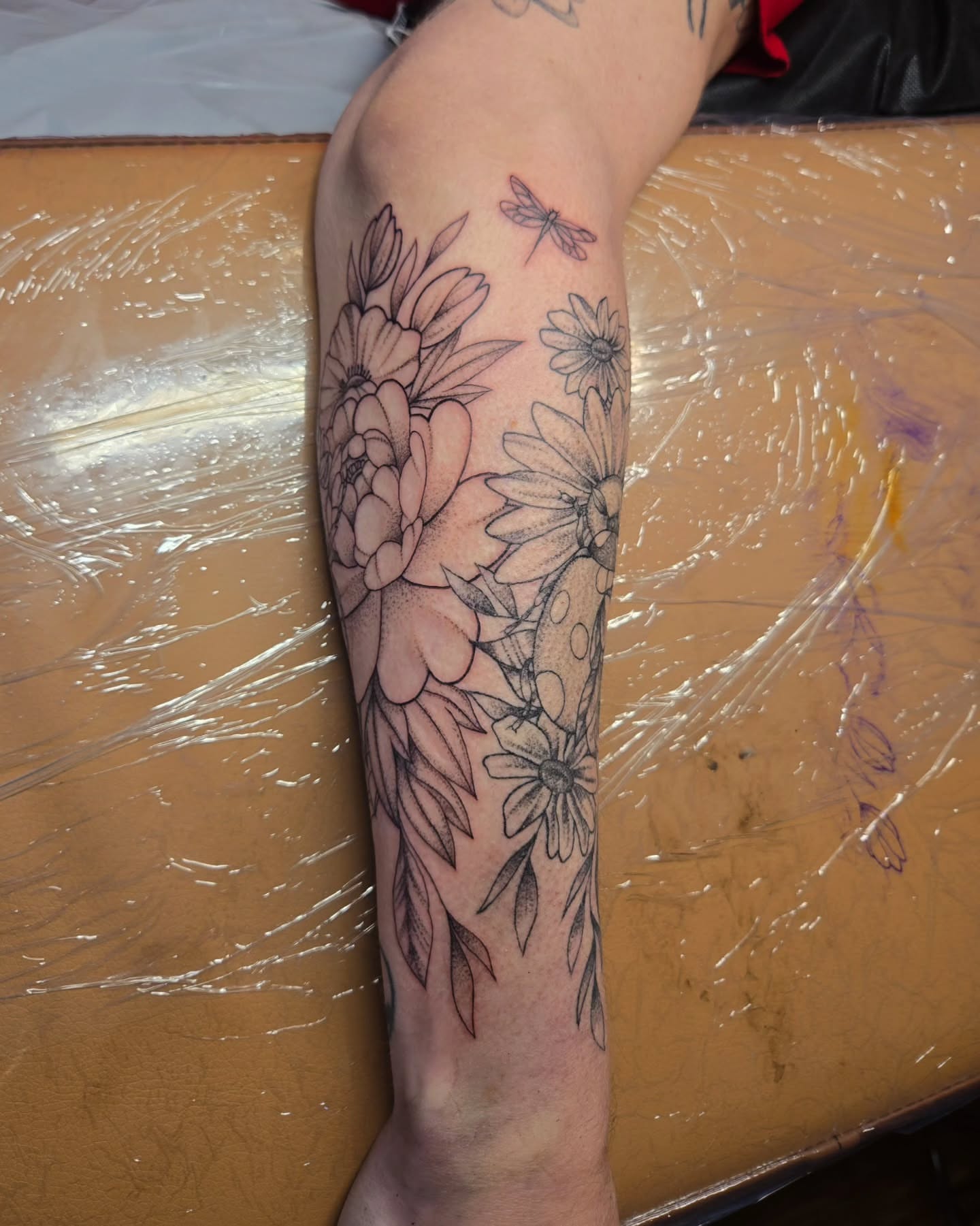 Floral arrangement black and grey tattoo on the forearm by jo(rdan)