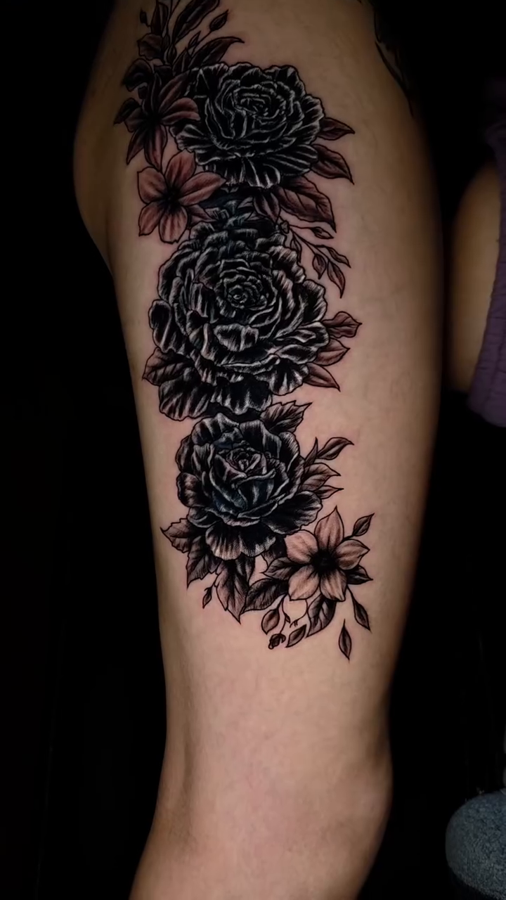 Floral arrangement on thigh neo-traditional tattoo on the leg by Jeff Frederick