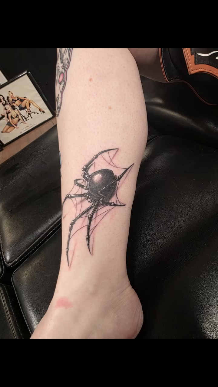 Black widow spider tattoo blackwork tattoo on the forearm by Jeff Frederick