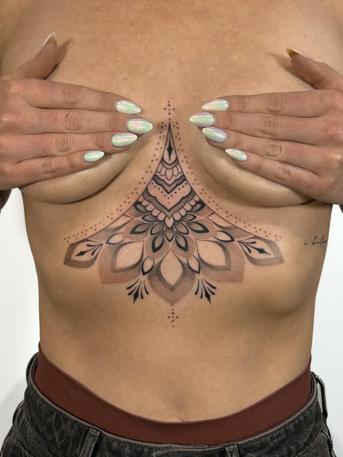 Mandala dotwork tattoo on the chest by Chloe