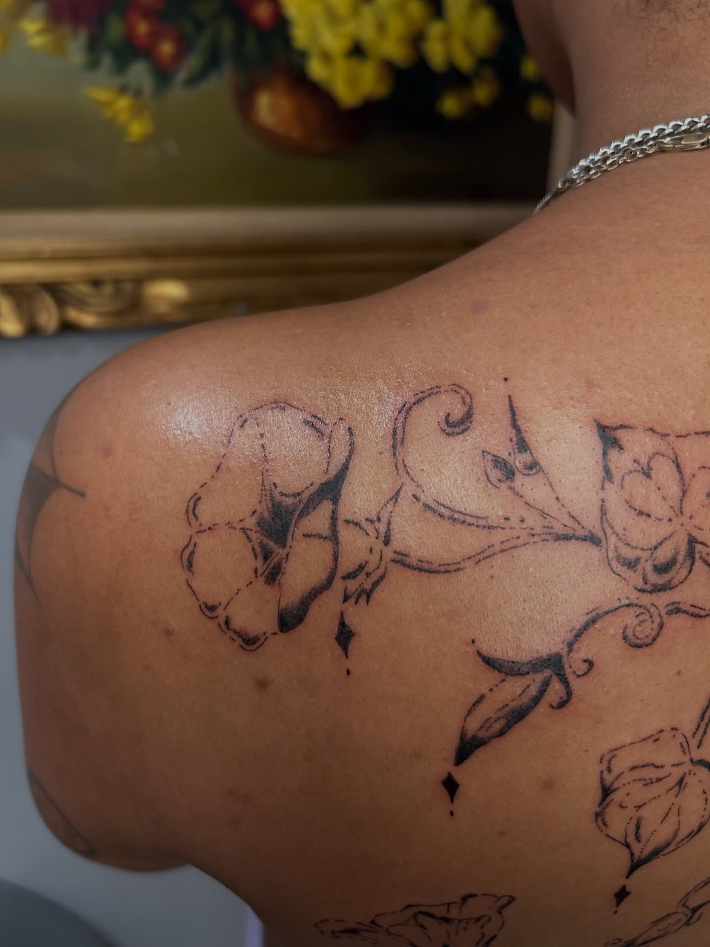 Floral design black and grey tattoo on the shoulder by wanderfernfairy