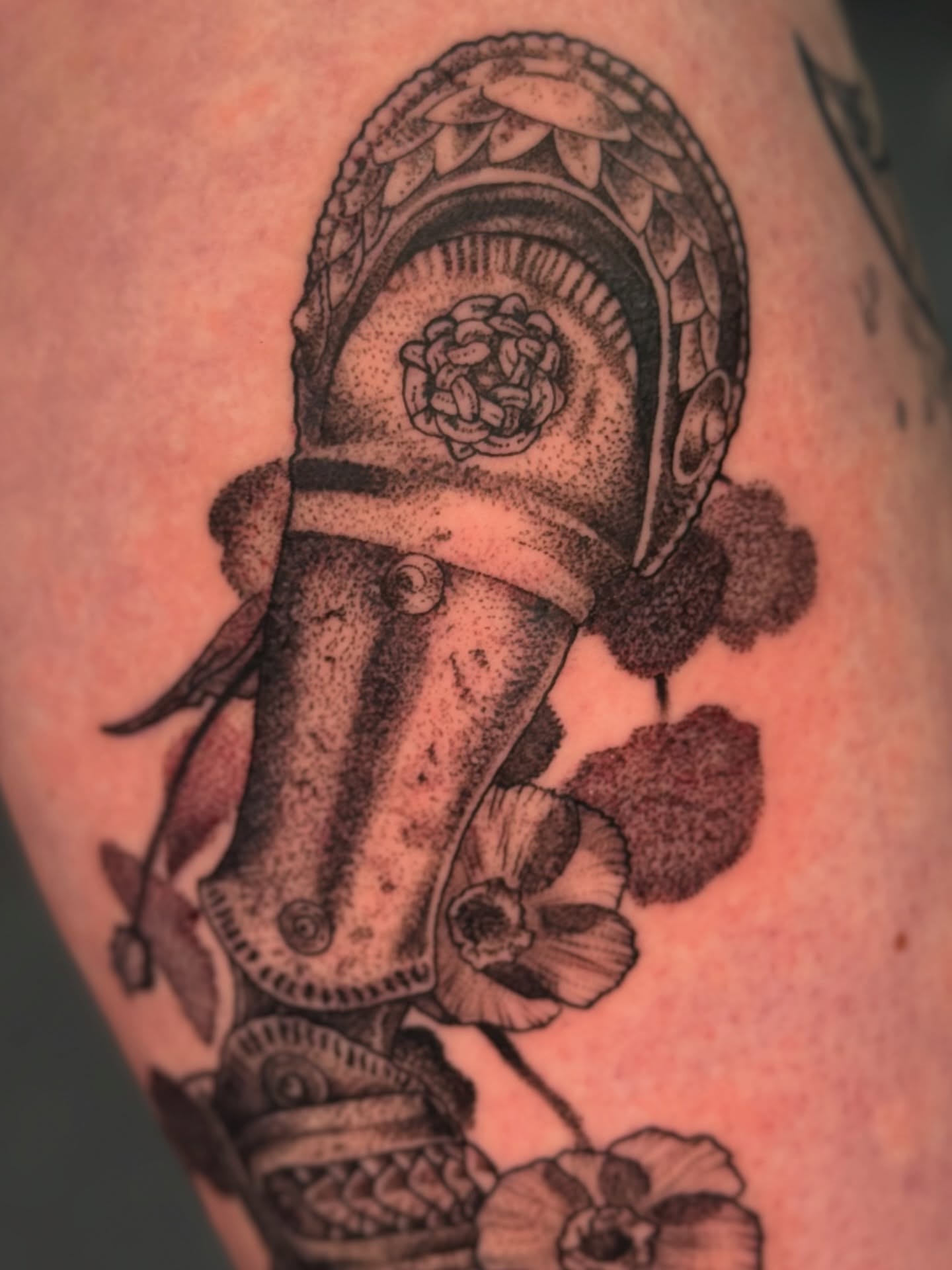 Fire hydrant dotwork tattoo on the upper arm by Erin Morbid