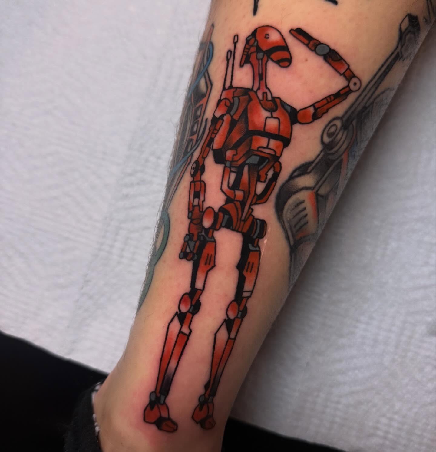 Robot geometric tattoo on the forearm by Shelby