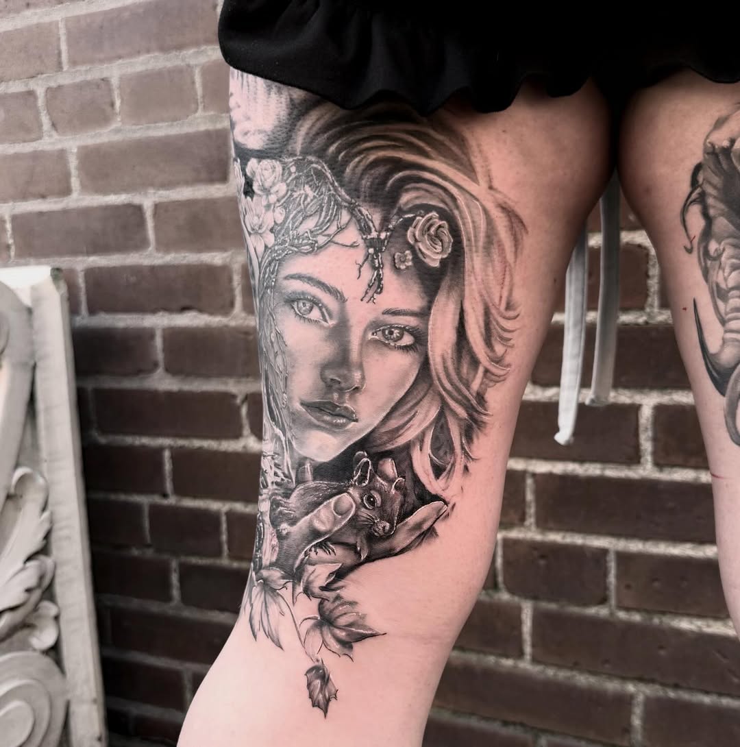 Woman holding a squirrel realism tattoo on the thigh by Blake Van Vleck