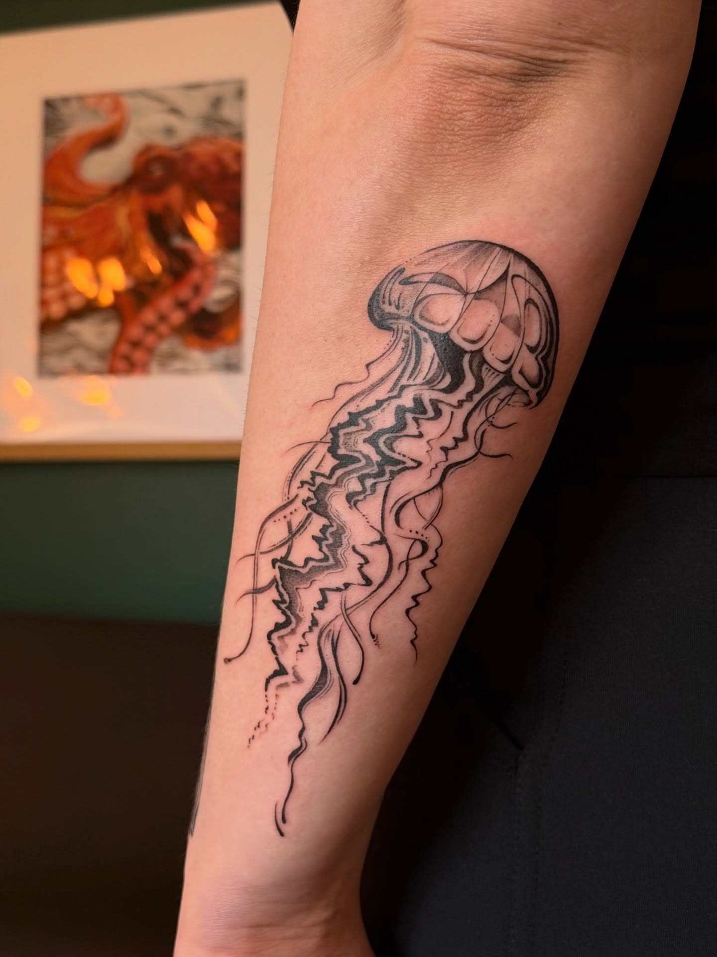 Jellyfish black and grey tattoo on the forearm by Kingtide Ink