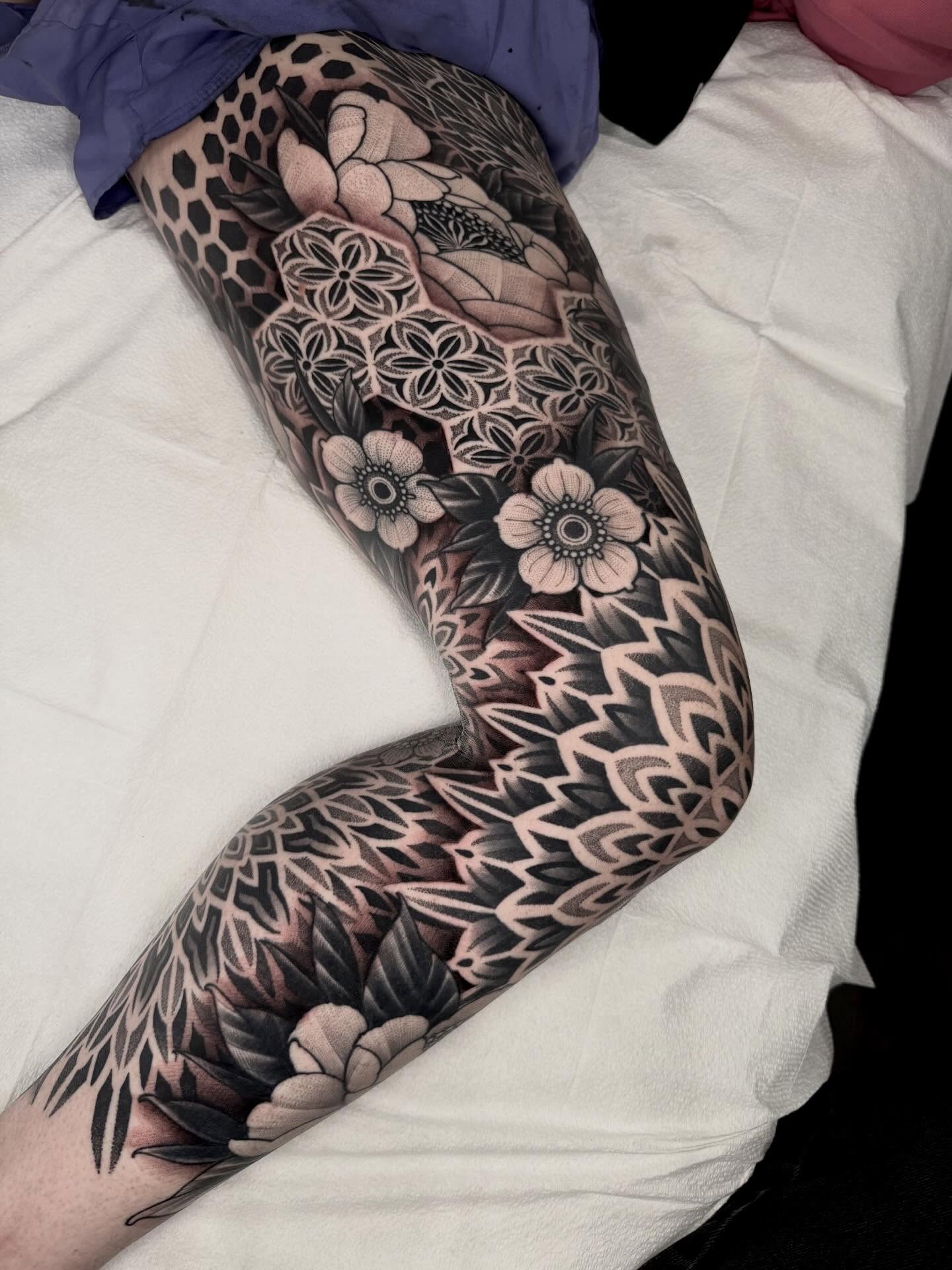 Floral mandala geometric tattoo on the leg by Kevin Johnson
