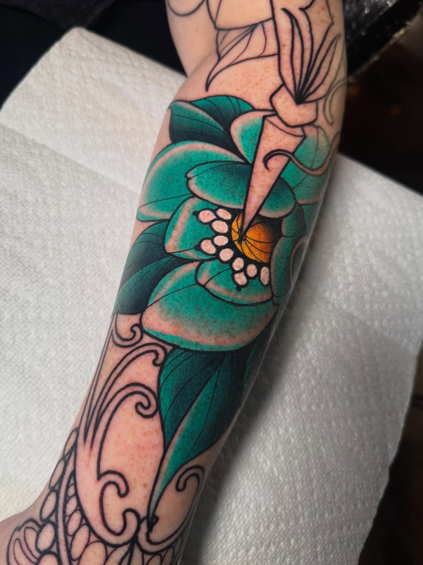 Flower American traditional tattoo on the forearm by Jess Longfield, Des Moines, Iowa