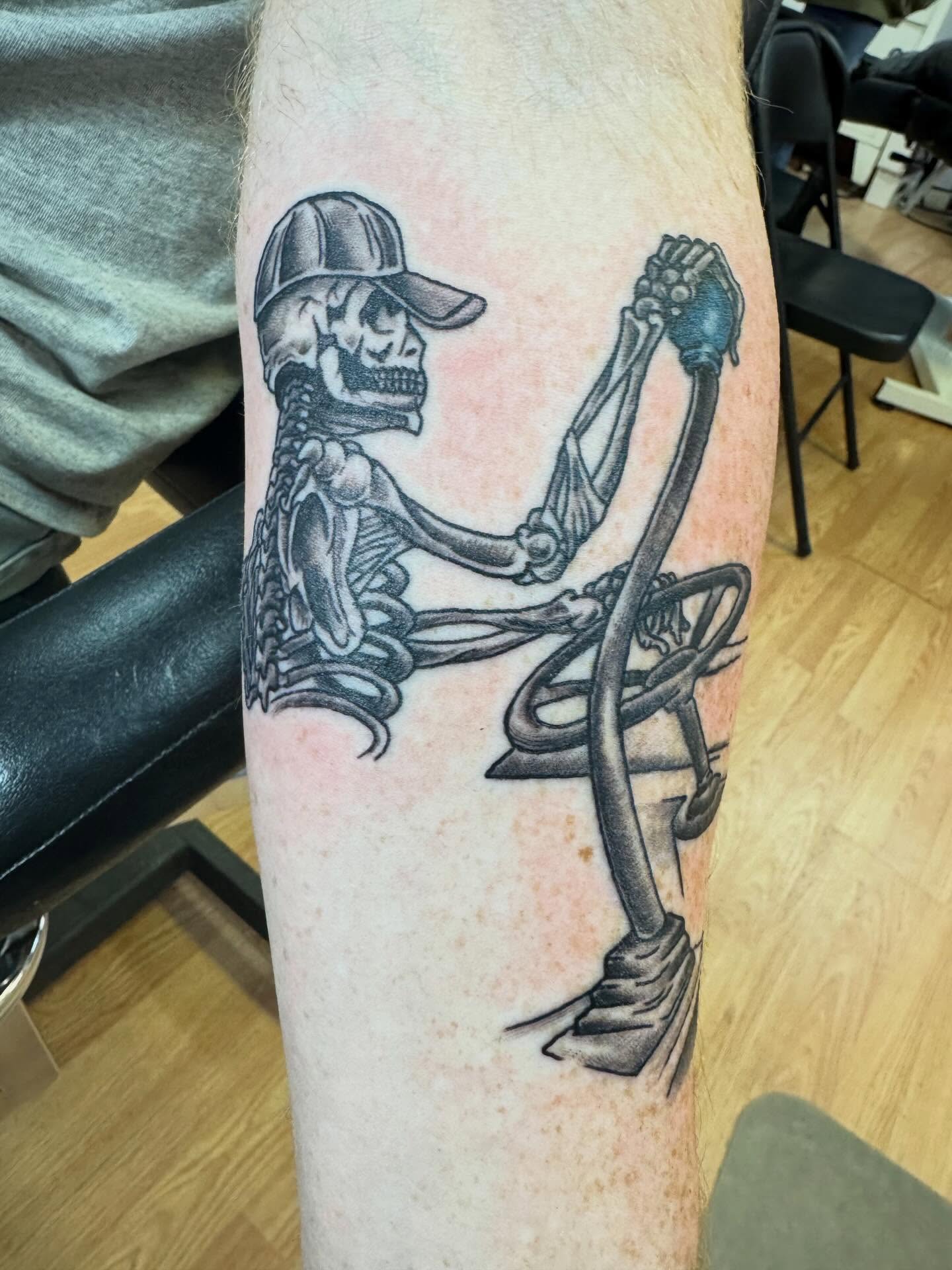 Skeleton diver black and grey tattoo on the forearm by Justin Fiveson